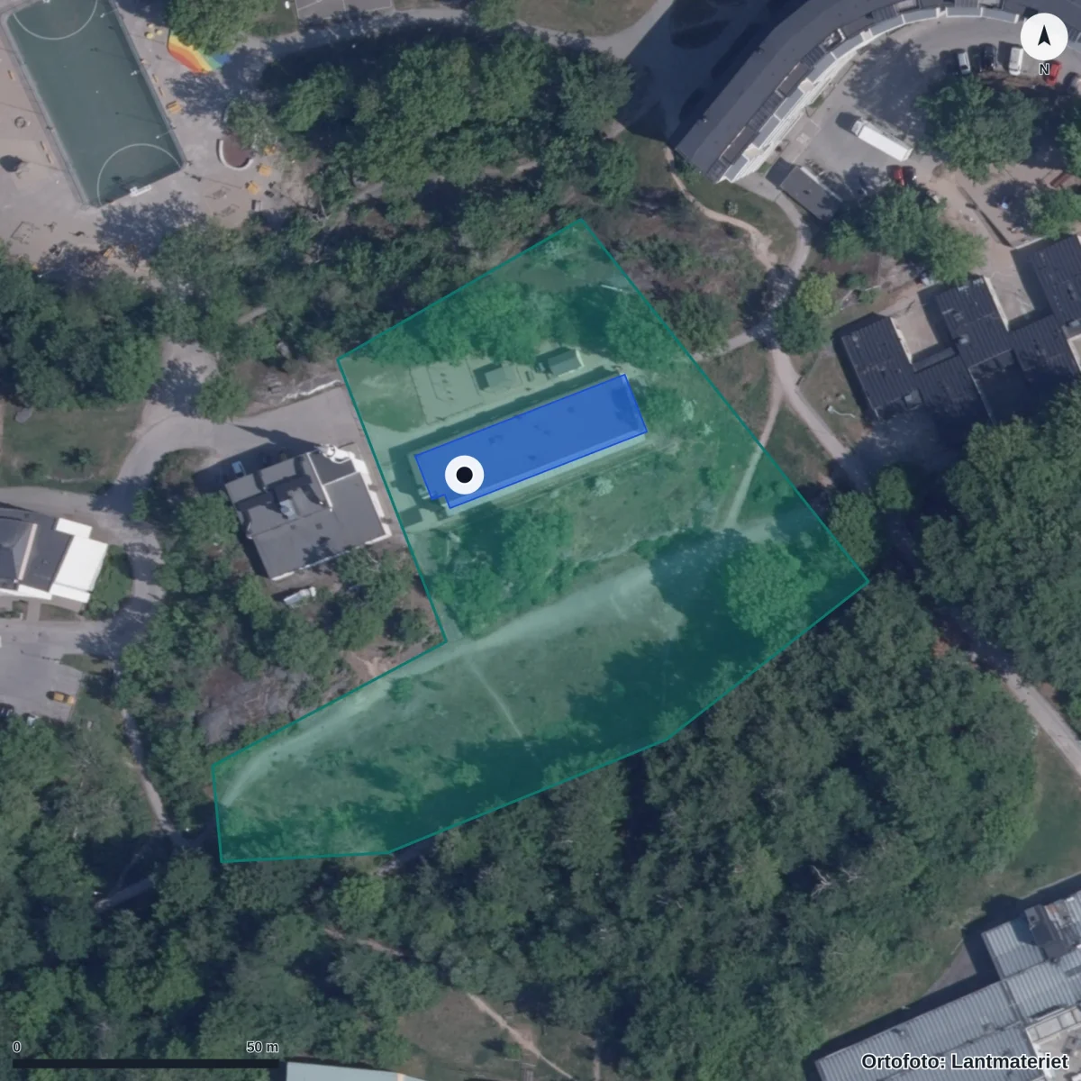 Flygbild över Wämö Förskola Blå Port, ortofoto från Lantmäteriet