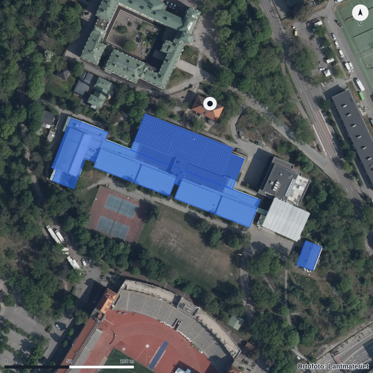 Flygbild över Förskolan Läkarvillan, ortofoto från Lantmäteriet