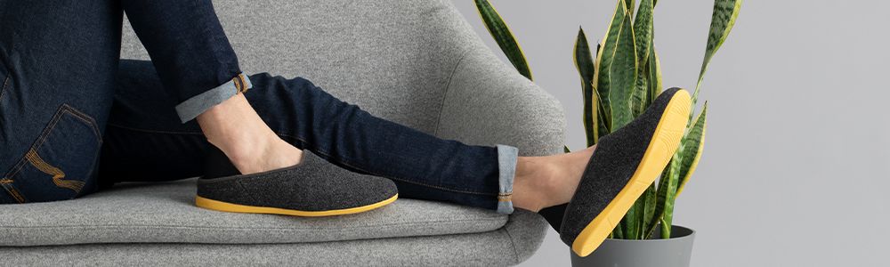 resting with slipper on couch