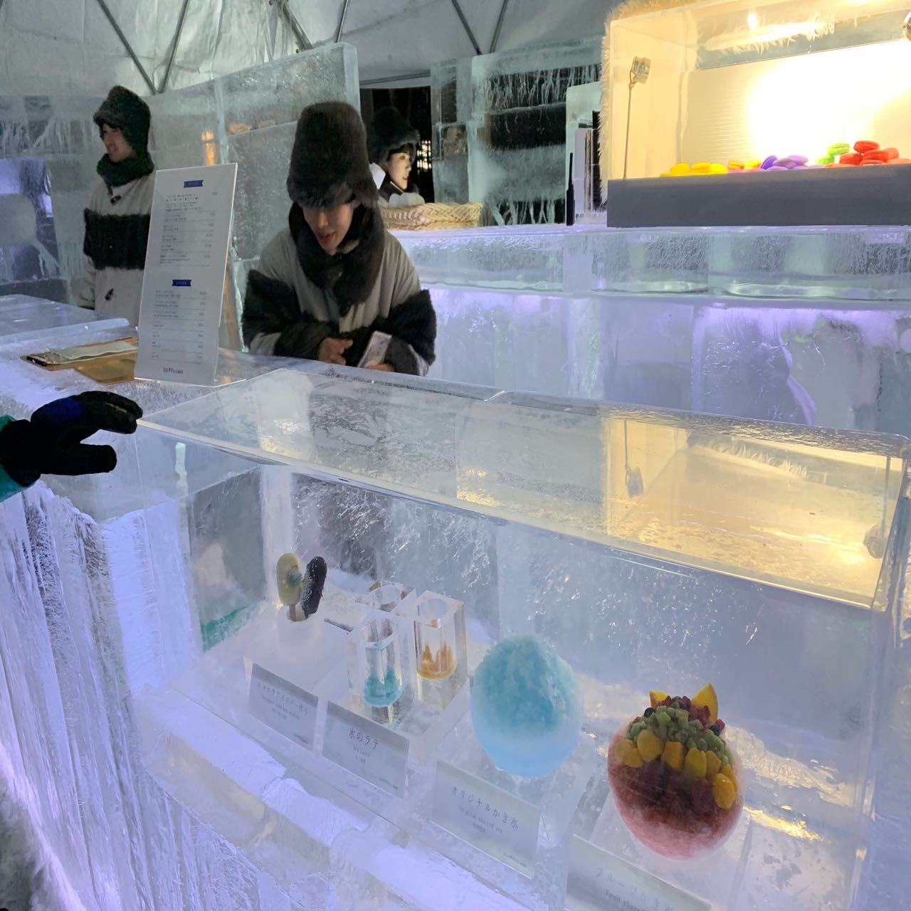 Enjoying some nice delicacy at the ice village in …