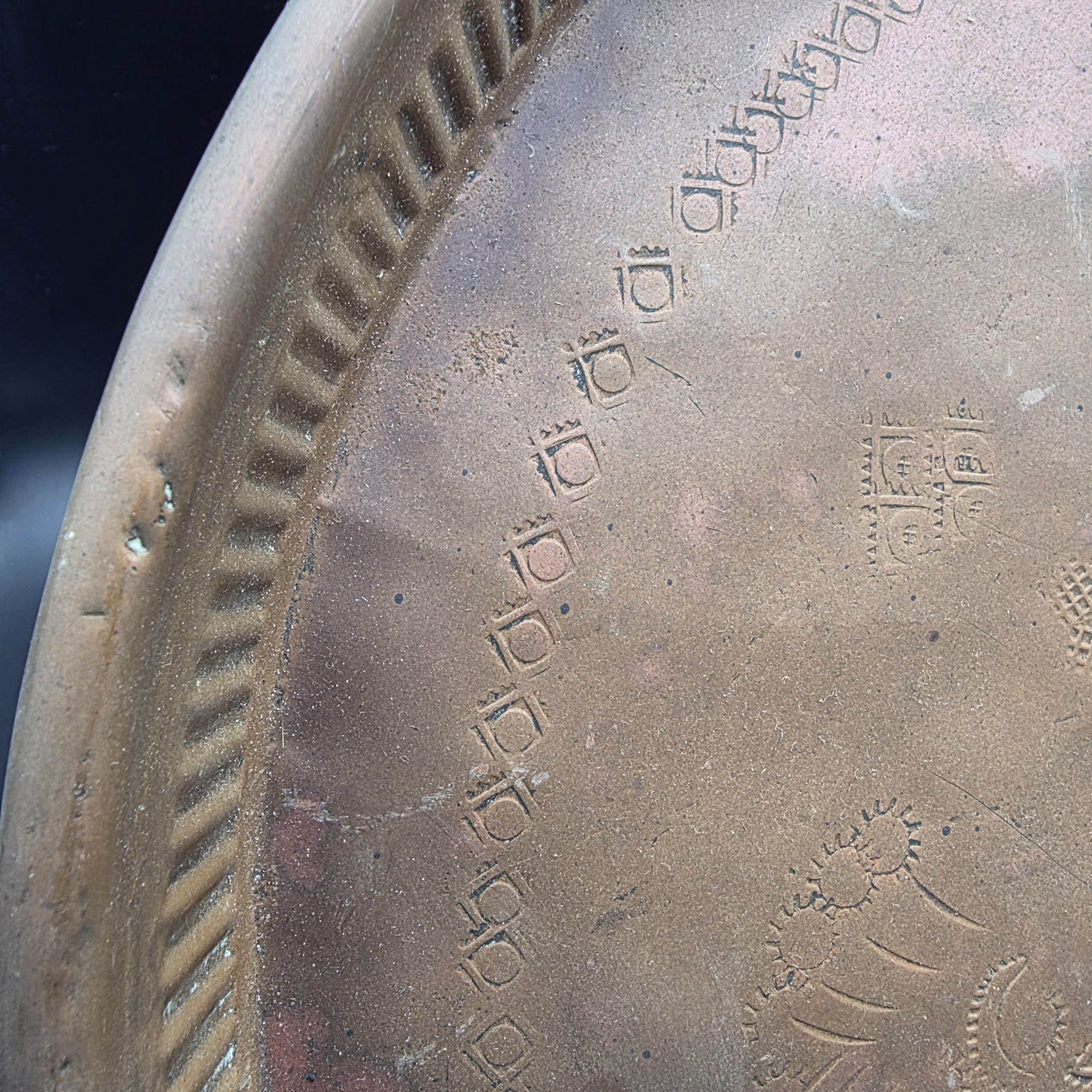 A collection of vintage copper and brass decorative and functional items, comprising two copper trays, a copper teapot, and an embossed brass wall plate depicting a sailing ship. - View 4