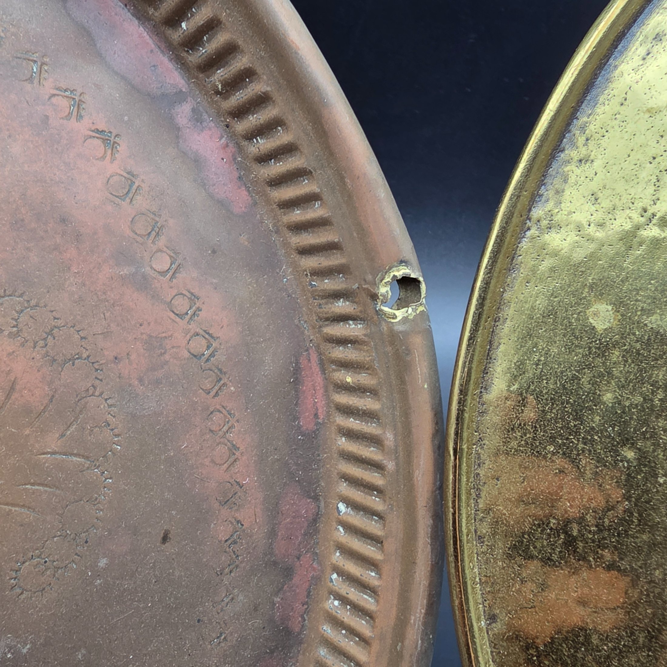 A collection of vintage copper and brass decorative and functional items, comprising two copper trays, a copper teapot, and an embossed brass wall plate depicting a sailing ship. - View 5