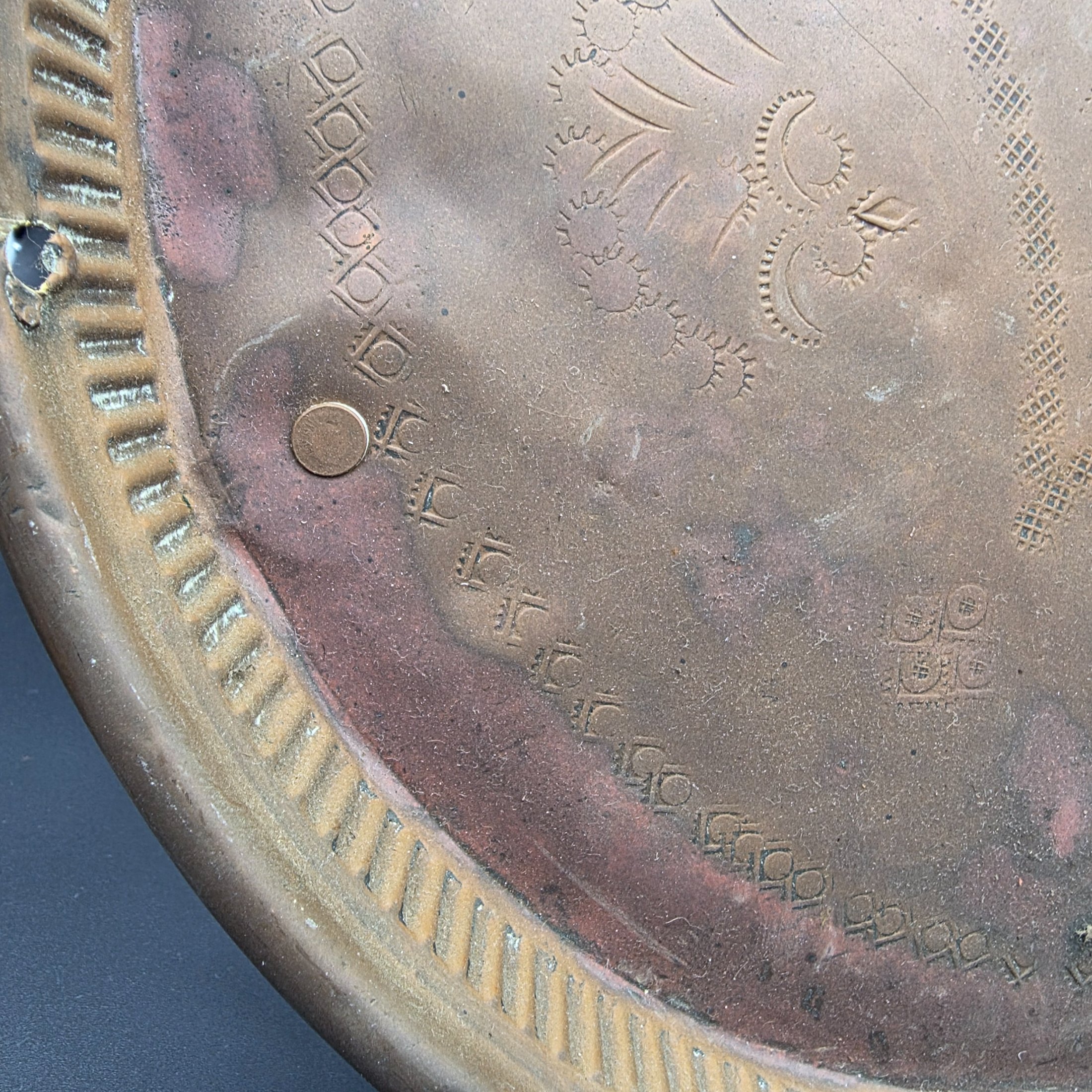 A collection of vintage copper and brass decorative and functional items, comprising two copper trays, a copper teapot, and an embossed brass wall plate depicting a sailing ship. - View 6