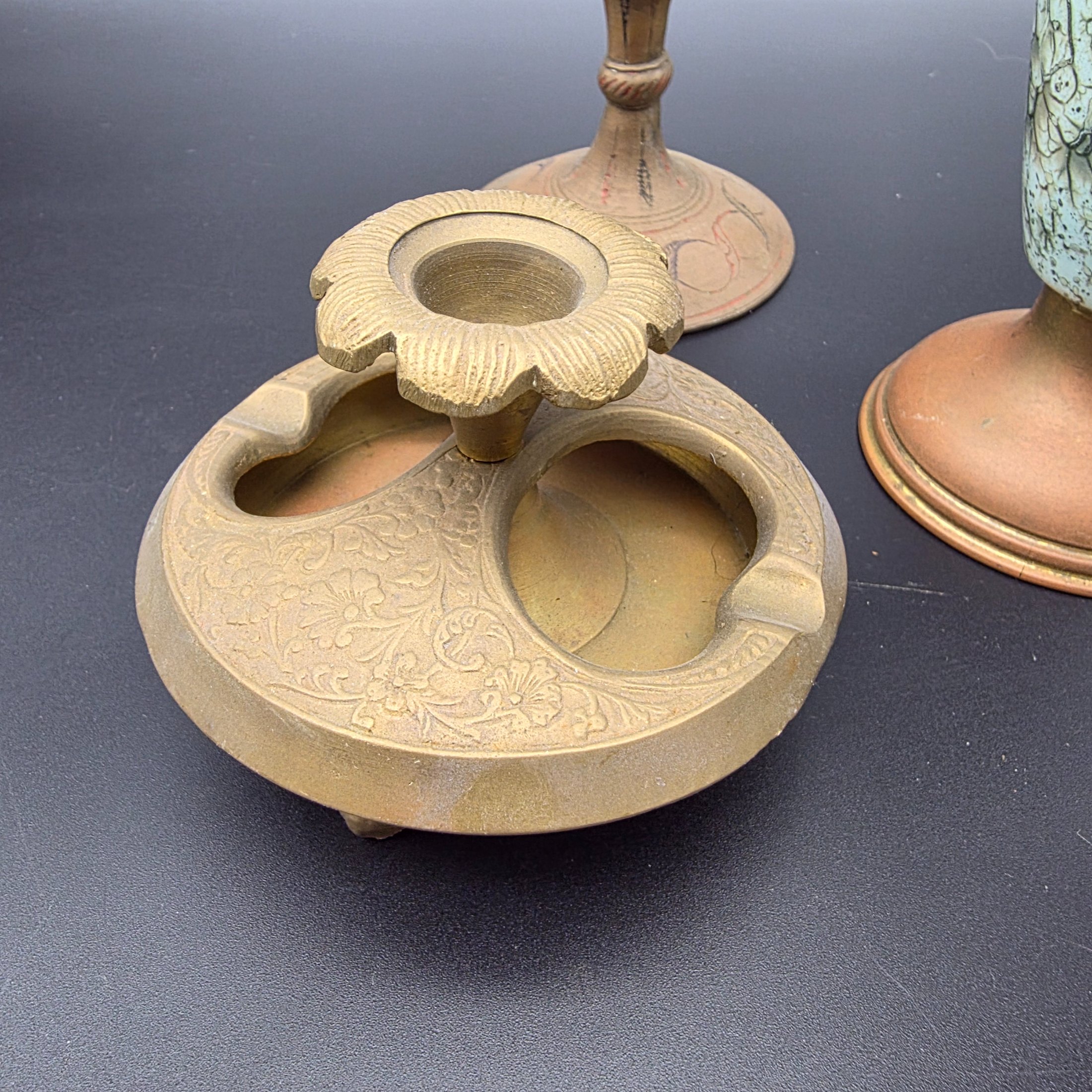 A curated collection of vintage decorative brass items, likely from the mid-20th century, featuring various engraved, enameled, and glazed finishes. - View 3
