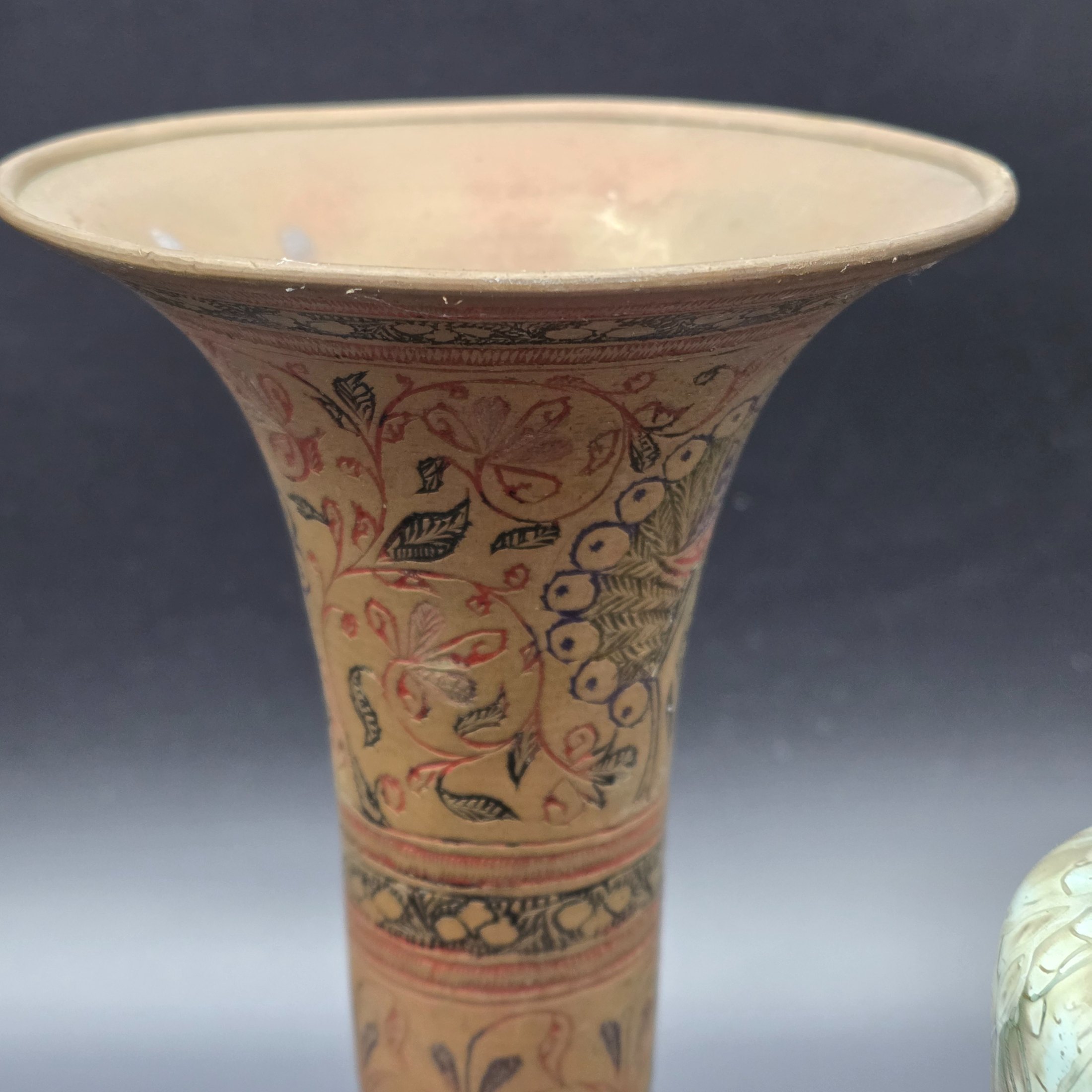 A curated collection of vintage decorative brass items, likely from the mid-20th century, featuring various engraved, enameled, and glazed finishes. - View 6