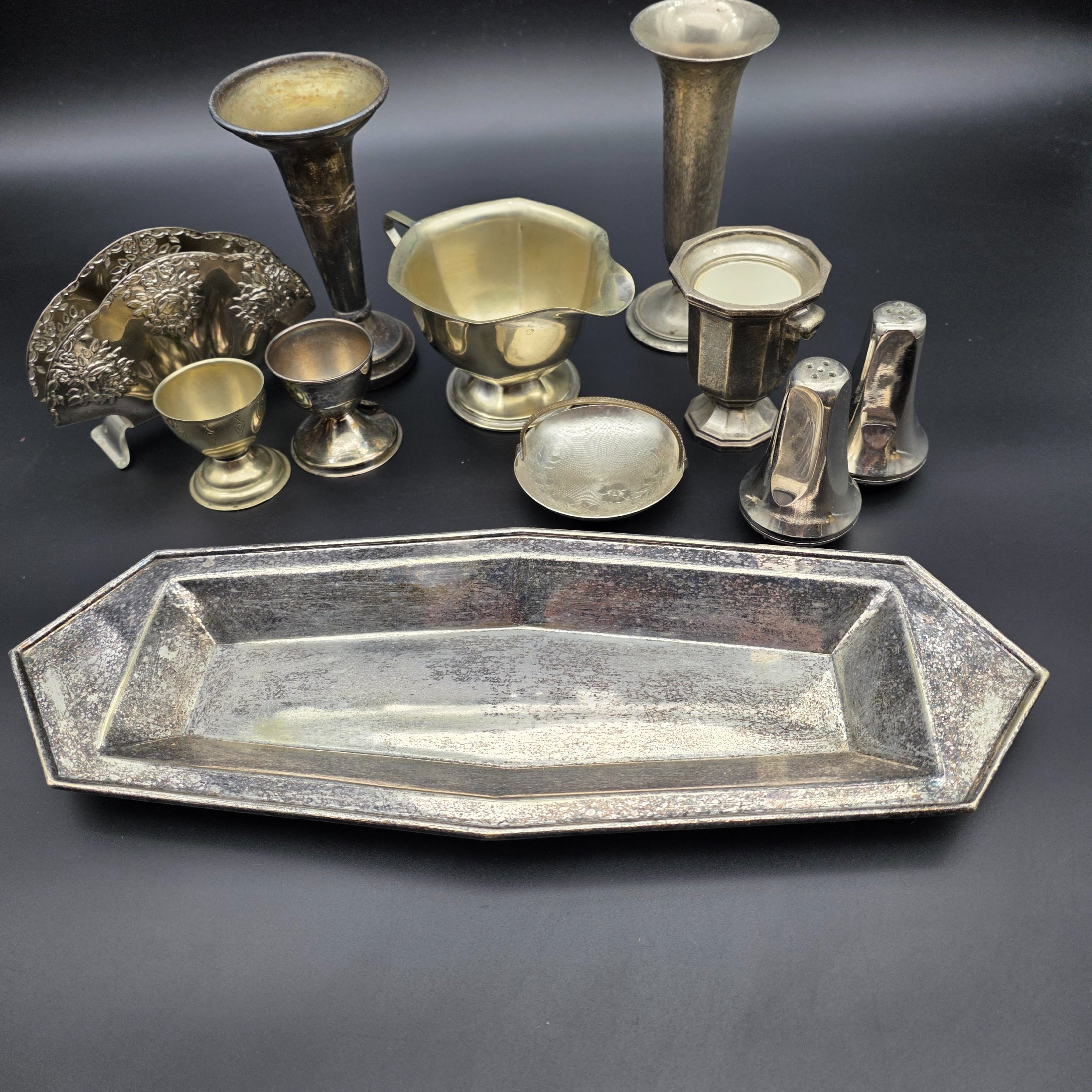 A diverse collection of vintage English silver-plated homewares, featuring various decorative and functional pieces. - View 2