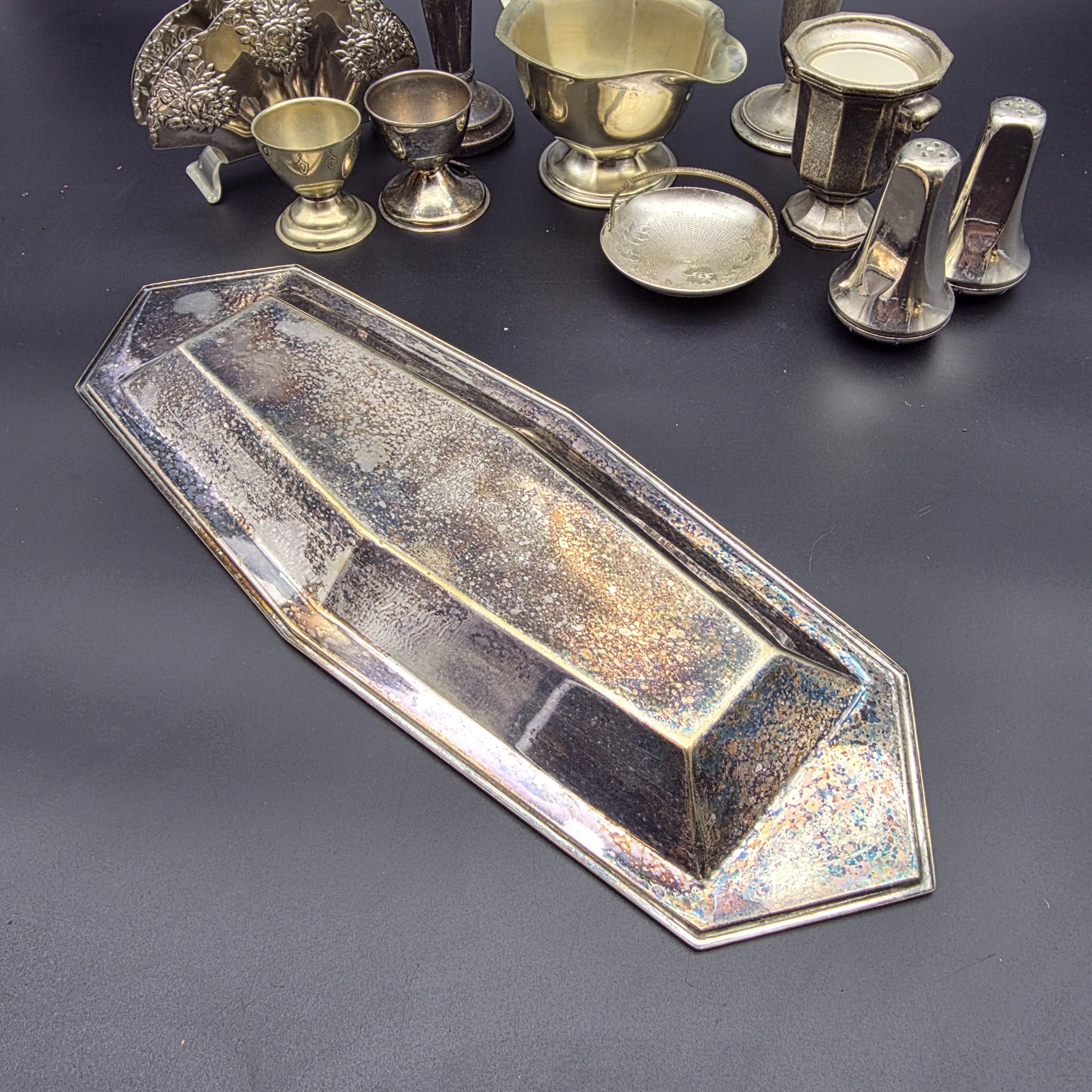 A diverse collection of vintage English silver-plated homewares, featuring various decorative and functional pieces. - View 3