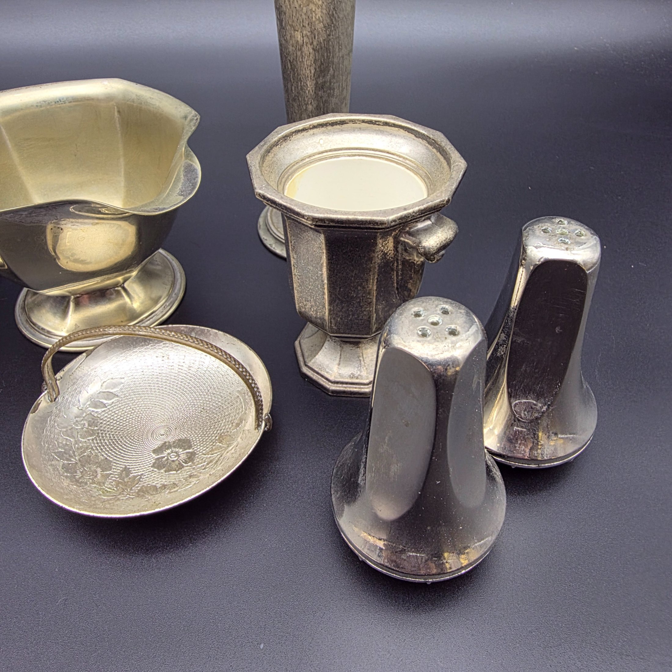 A diverse collection of vintage English silver-plated homewares, featuring various decorative and functional pieces. - View 4