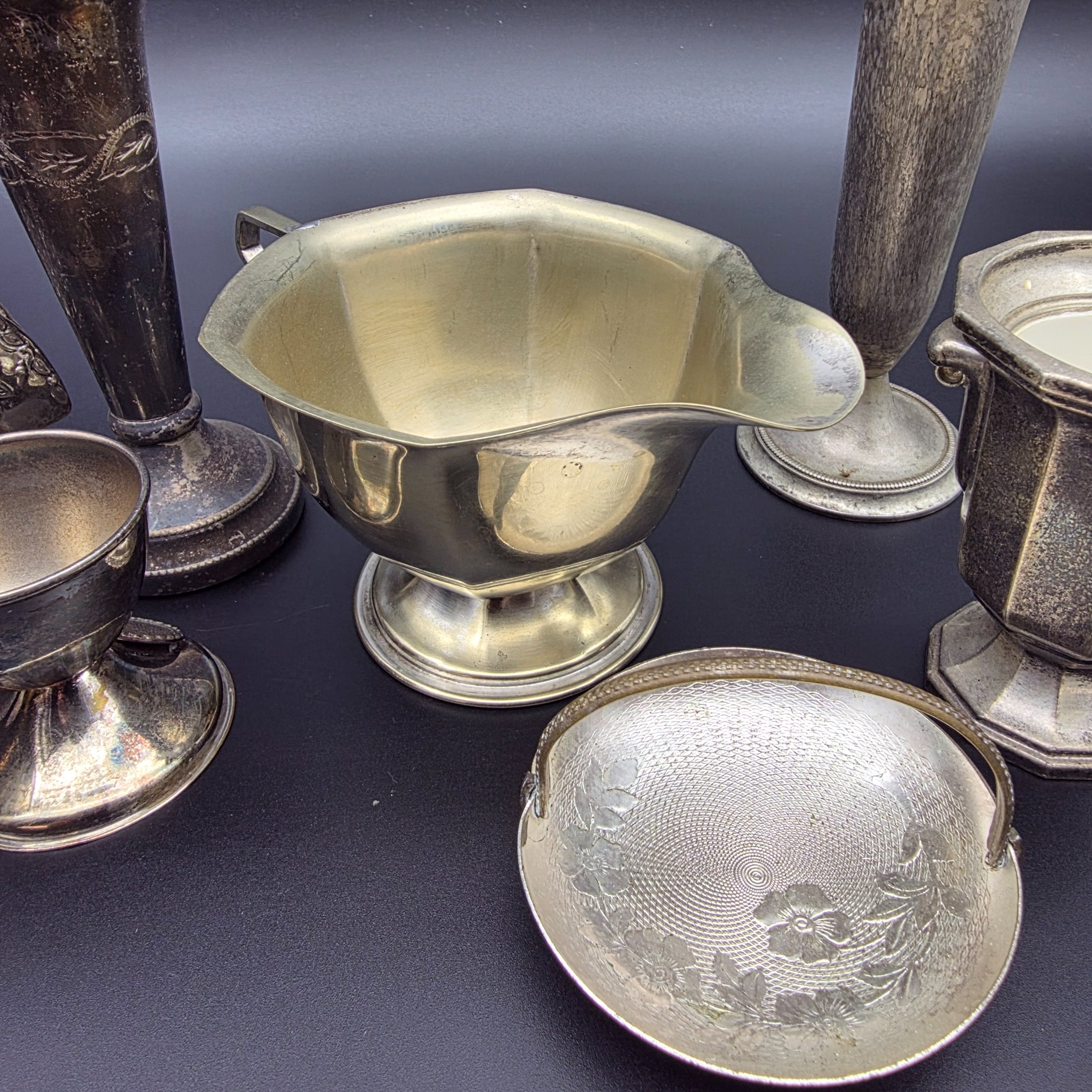 A diverse collection of vintage English silver-plated homewares, featuring various decorative and functional pieces. - View 6