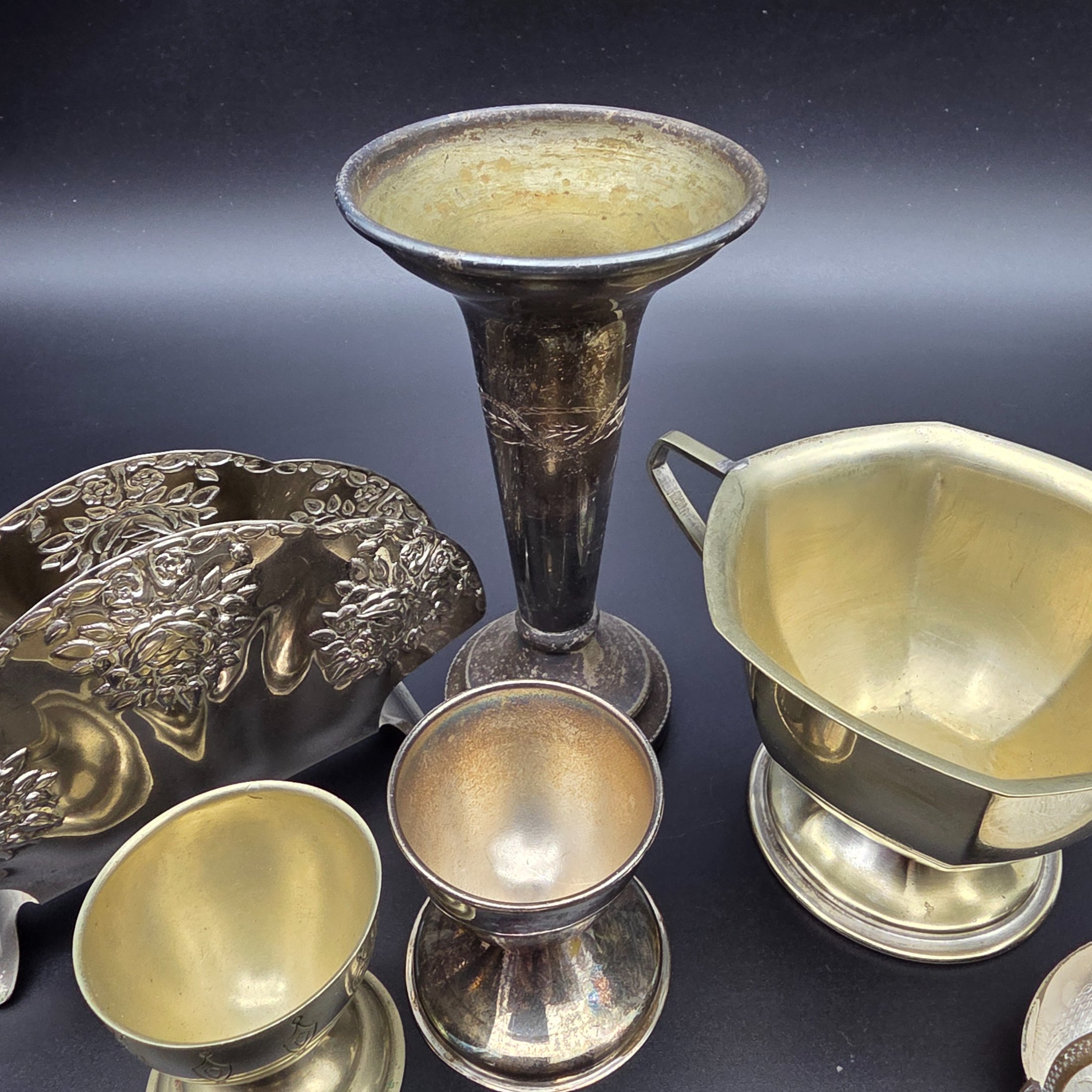 A diverse collection of vintage English silver-plated homewares, featuring various decorative and functional pieces. - View 7