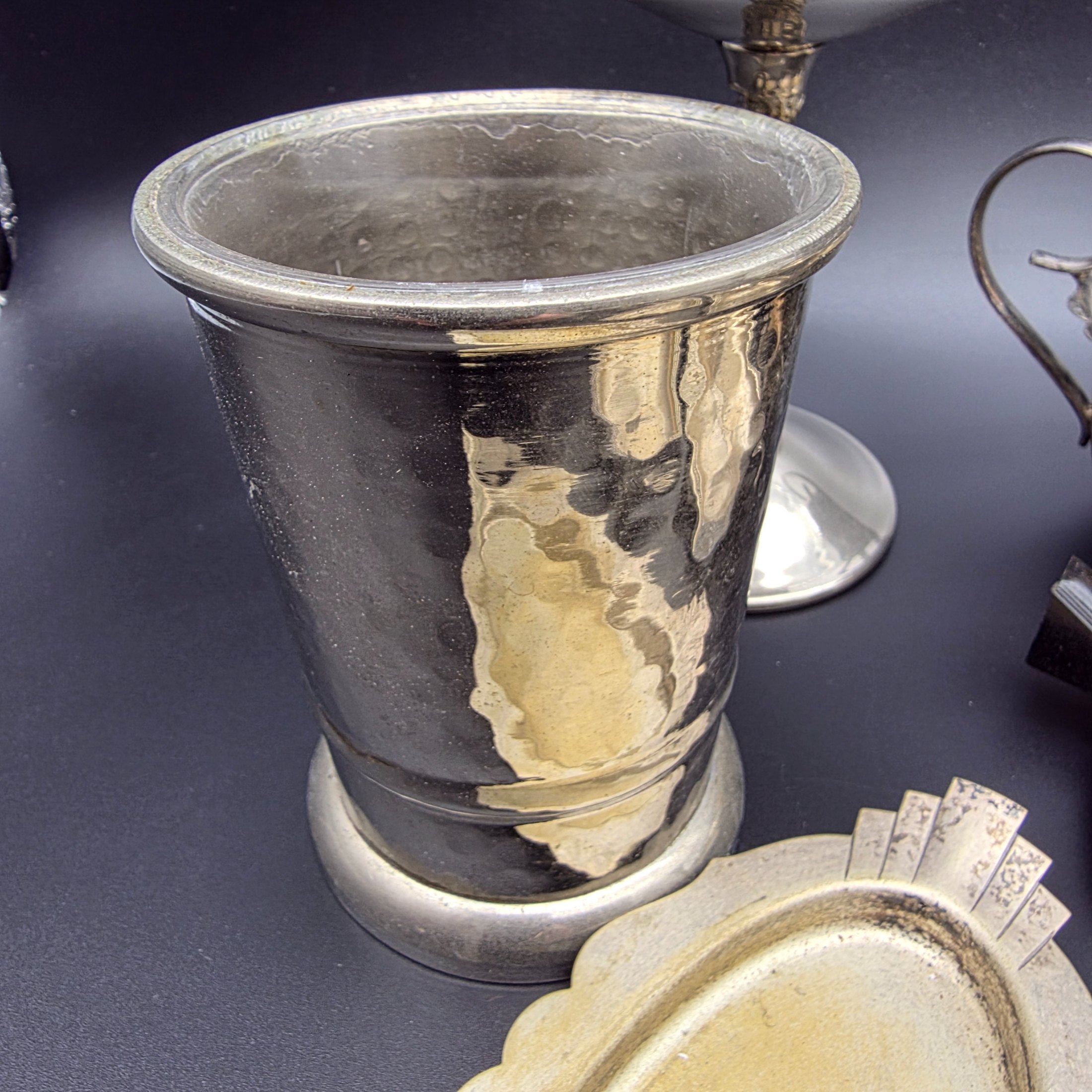 A varied collection of vintage F.B. Rogers silverplate items, including a compote, teapot, cream jug, sugar bowl, vase, goblet, and various trays, all showing signs of age and tarnishing. - View 8