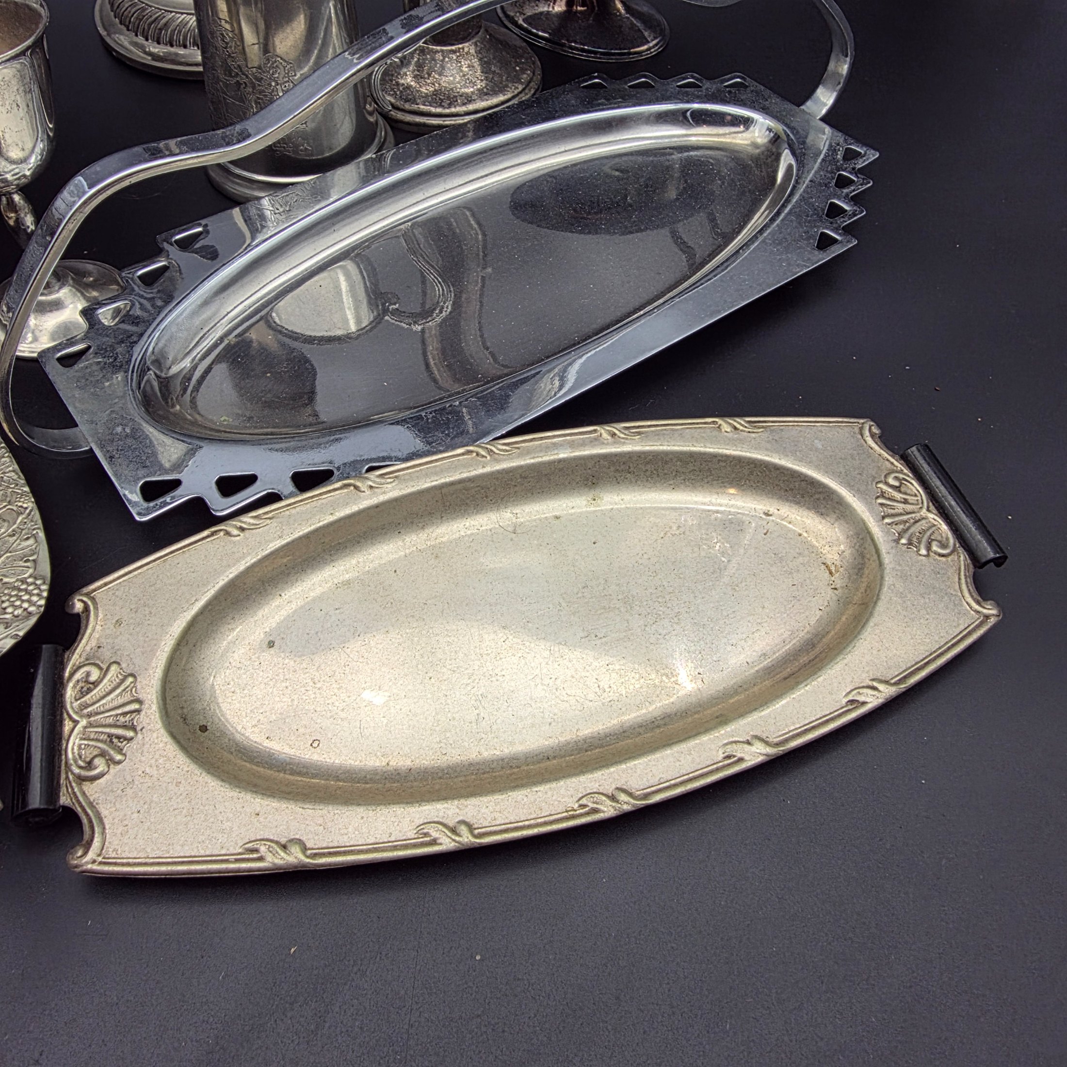 A comprehensive collection of vintage silver-plated homewares and decorative sundries, including various serving trays, a cake stand, candlesticks, a goblet, a tankard, and decorative bowls. - View 2