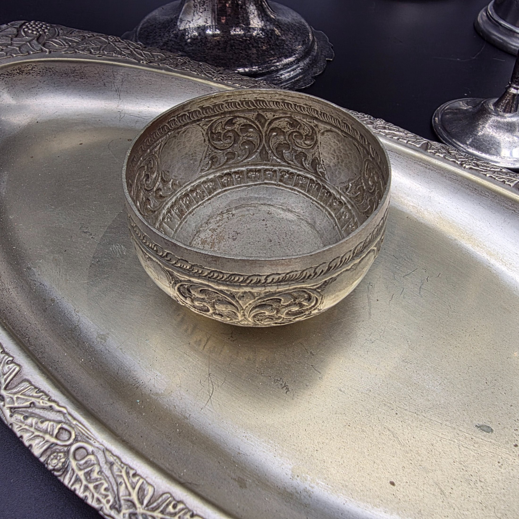 A comprehensive collection of vintage silver-plated homewares and decorative sundries, including various serving trays, a cake stand, candlesticks, a goblet, a tankard, and decorative bowls. - View 3