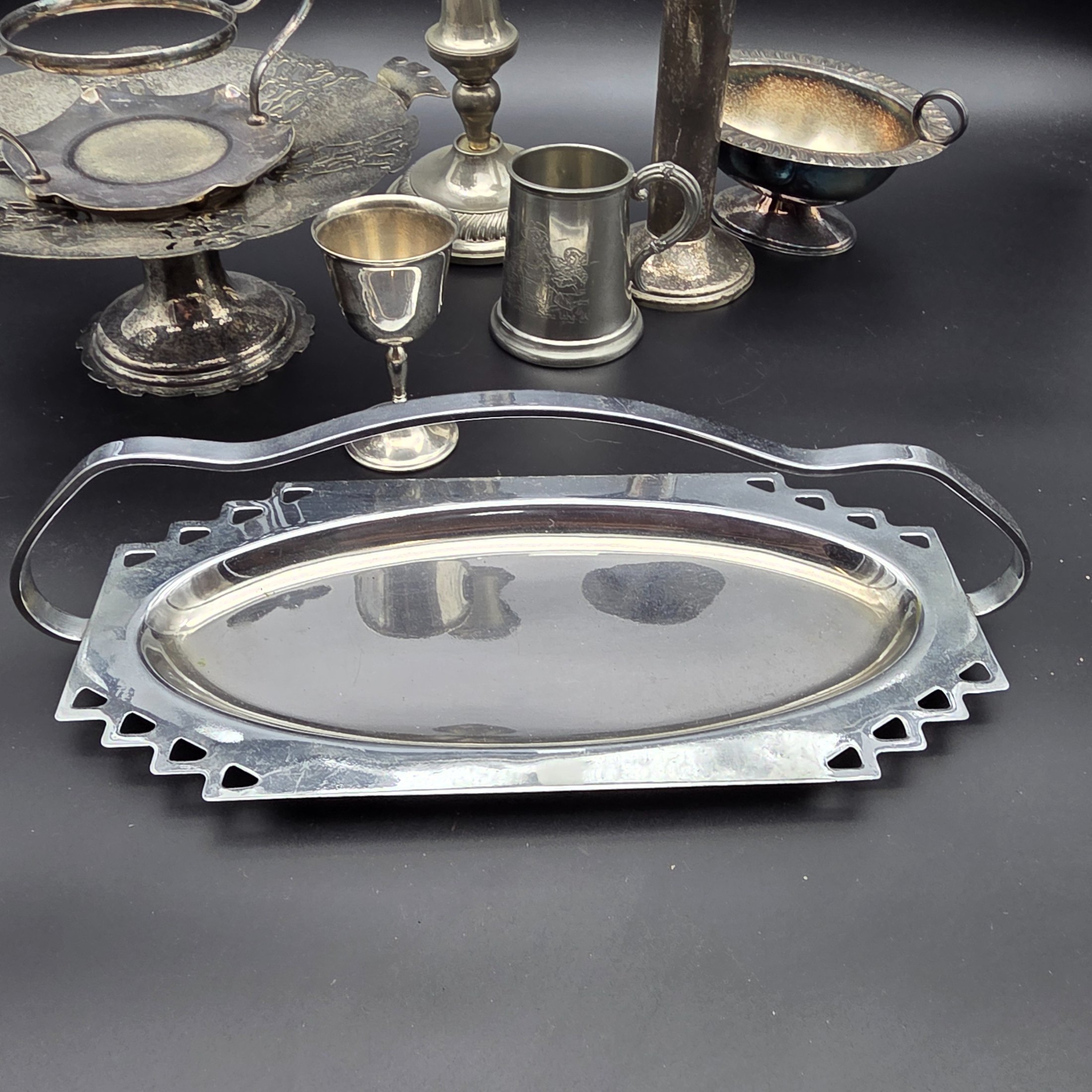 A comprehensive collection of vintage silver-plated homewares and decorative sundries, including various serving trays, a cake stand, candlesticks, a goblet, a tankard, and decorative bowls. - View 7