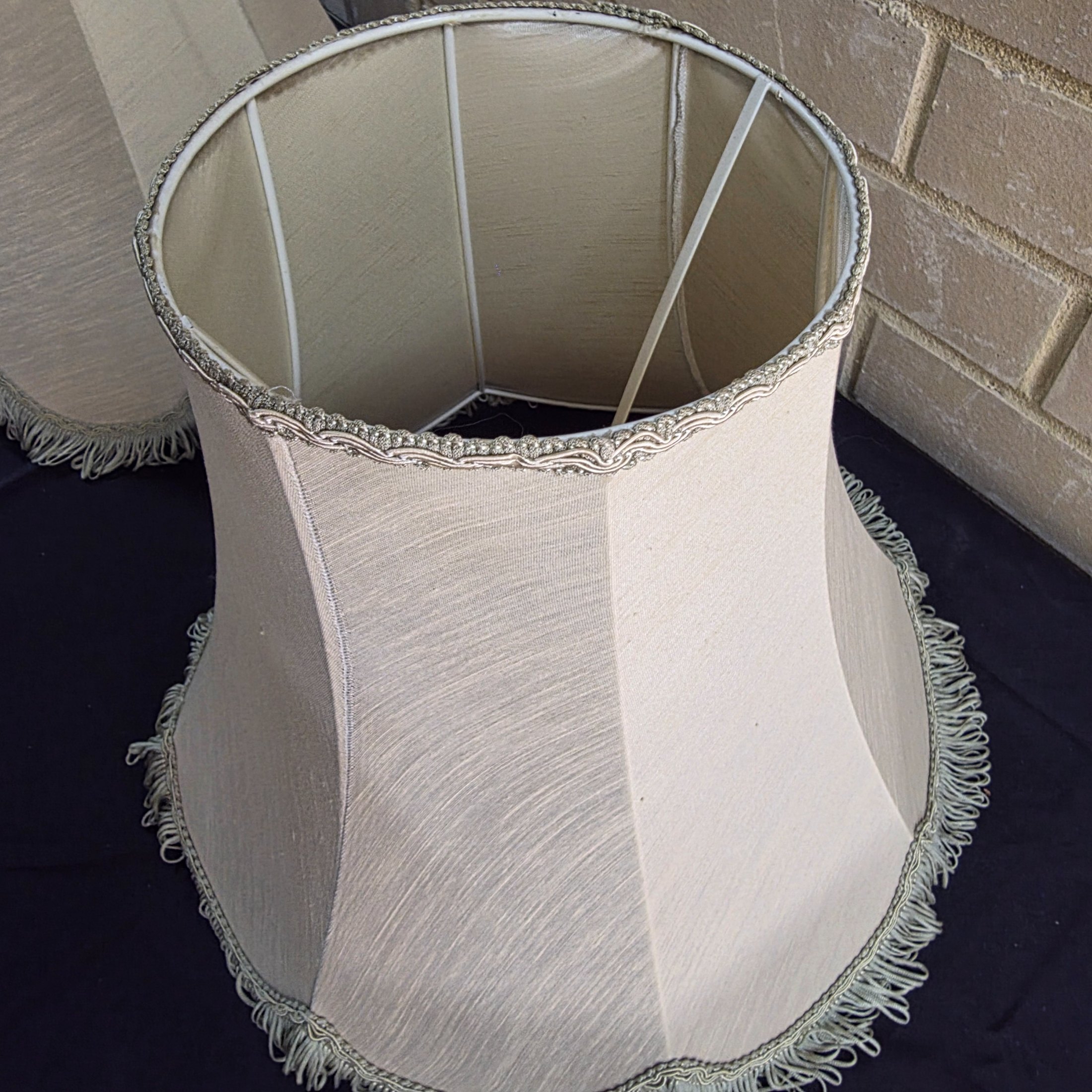 A pair of vintage bell-shaped lampshades, crafted from light fabric with ornate trim and fringe, suitable for traditional interior decor. - View 6
