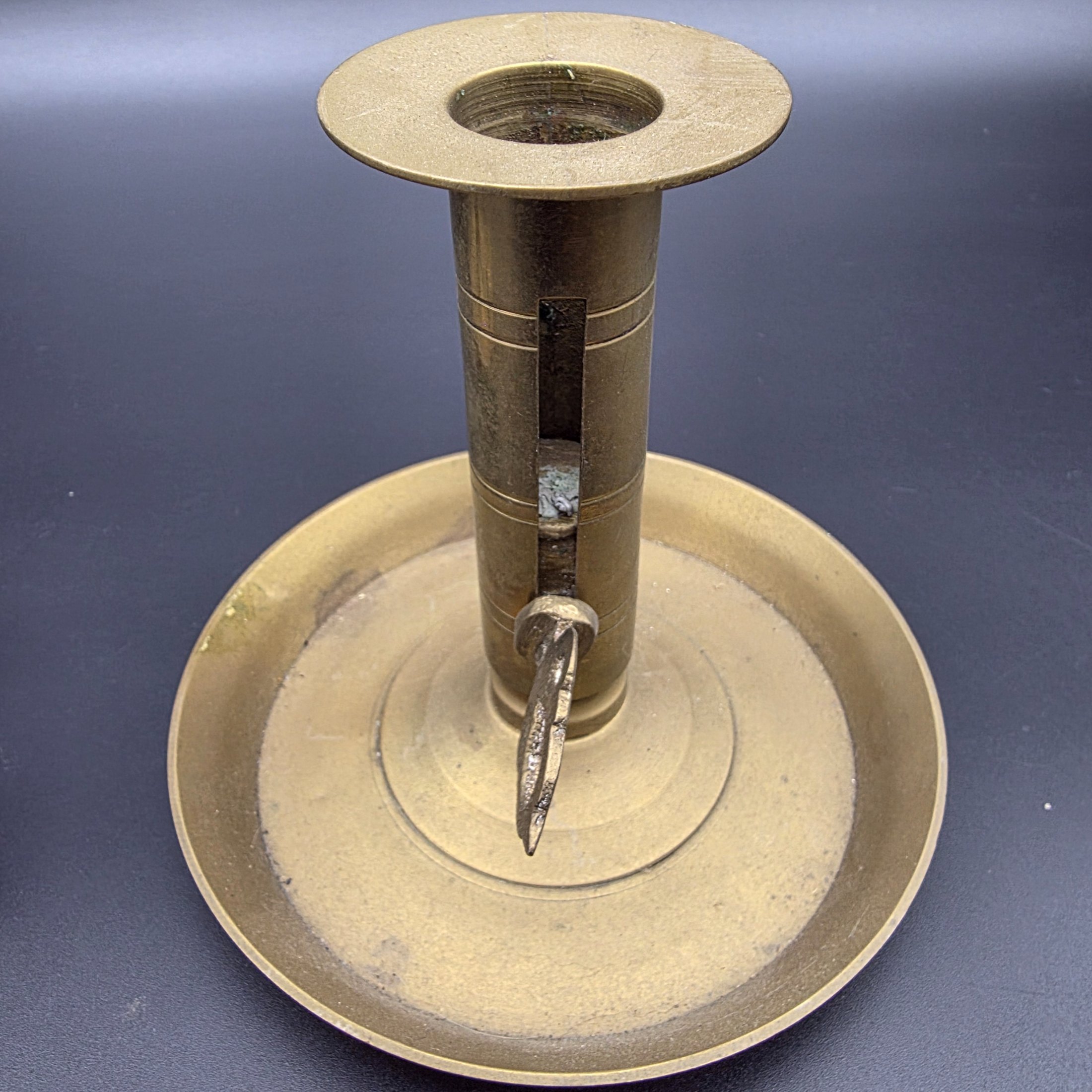 A lot of vintage brass and copper candle accessories, including two candlesticks and a decorative taper holder with an attached snuffer, likely dating from the early to mid-20th century. - View 8