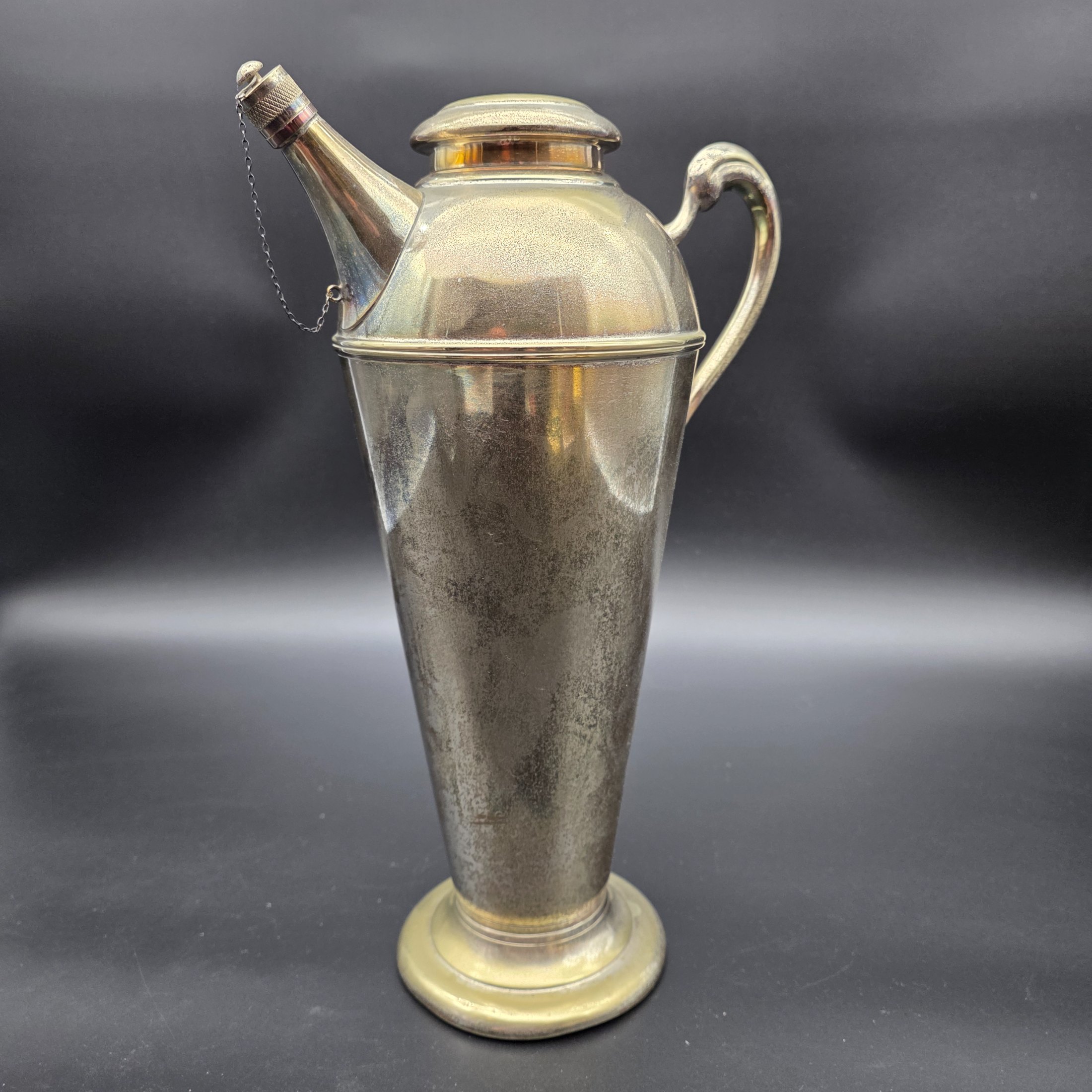 A vintage Renown EPNS A1 (Electro-Plated Nickel Silver) cocktail shaker or jug with a spouted design, handle, and a removable lid, dating from the mid-20th century.