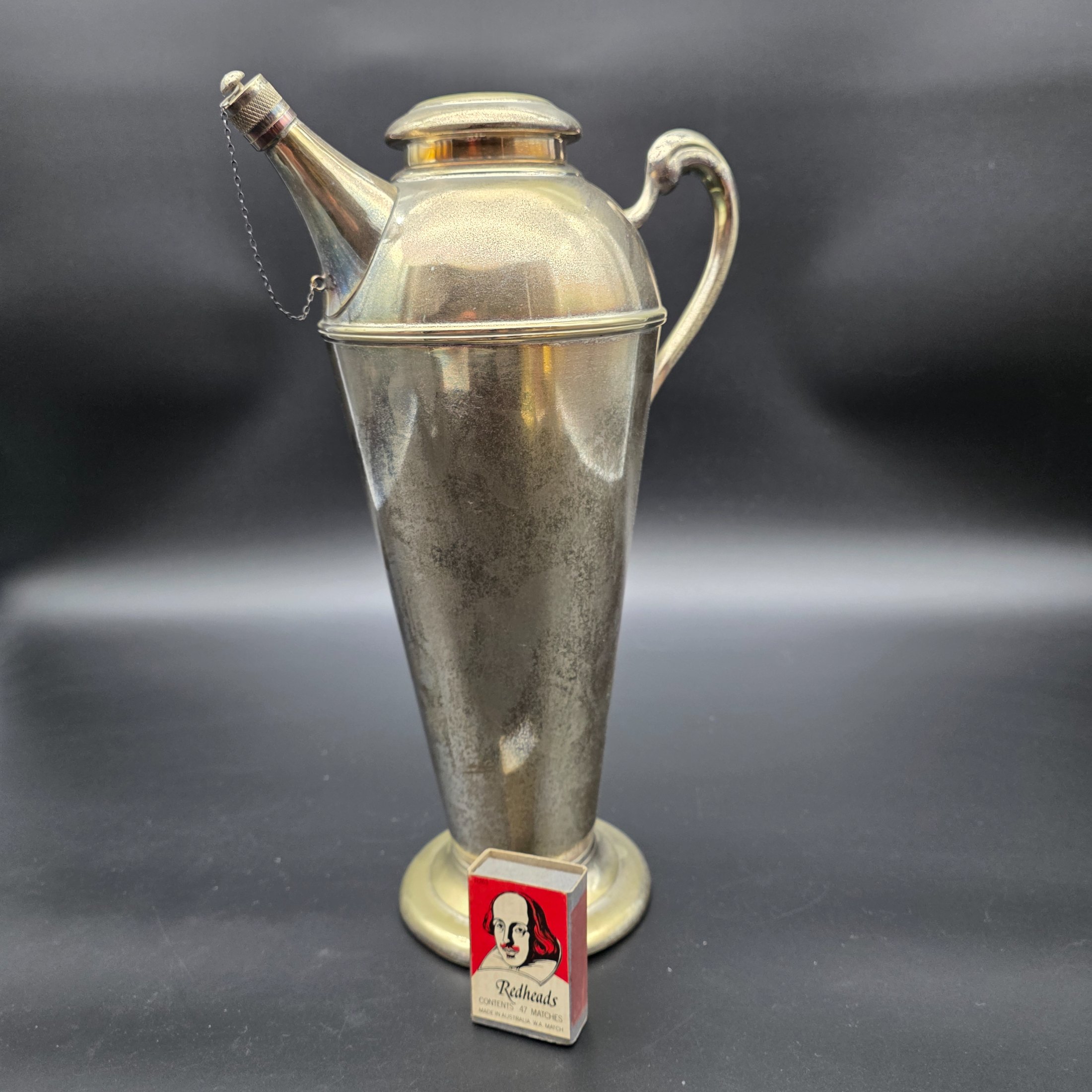 A vintage Renown EPNS A1 (Electro-Plated Nickel Silver) cocktail shaker or jug with a spouted design, handle, and a removable lid, dating from the mid-20th century. - View 2