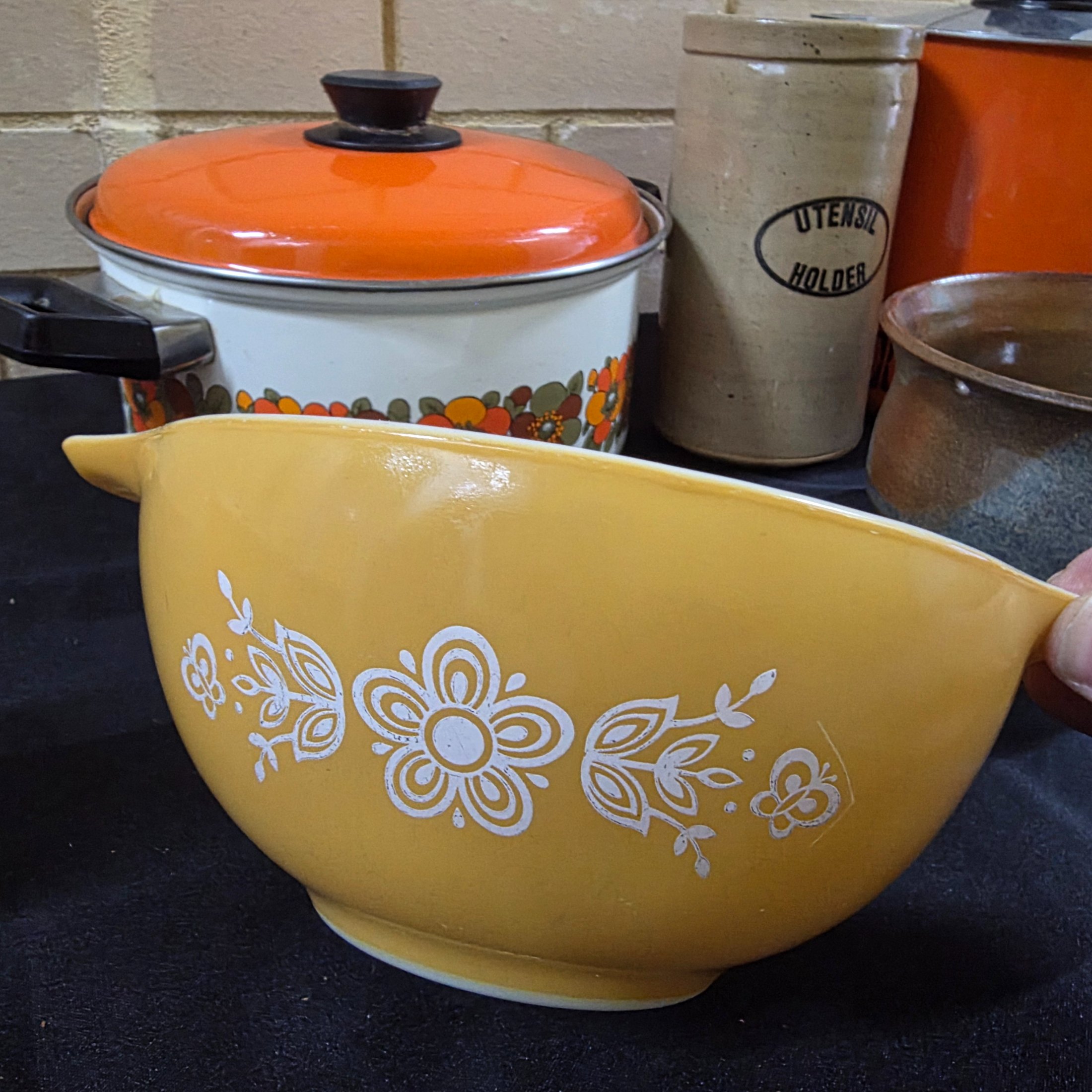 A varied collection of vintage kitchenware and homewares, showcasing mid-century design and practical items, including enamel pots, ceramic and stoneware pieces, and Australian beer coolers. - View 4
