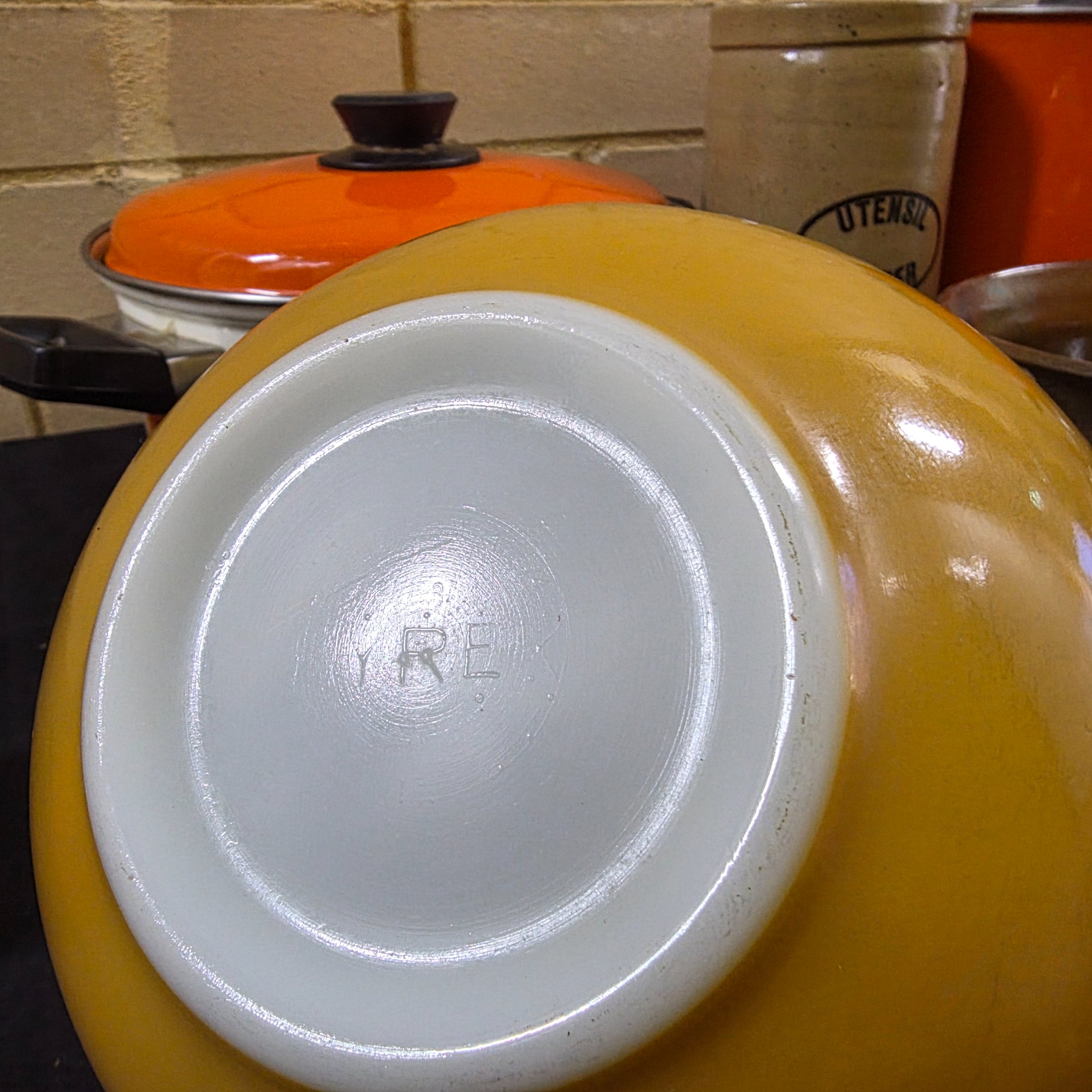 A varied collection of vintage kitchenware and homewares, showcasing mid-century design and practical items, including enamel pots, ceramic and stoneware pieces, and Australian beer coolers. - View 5