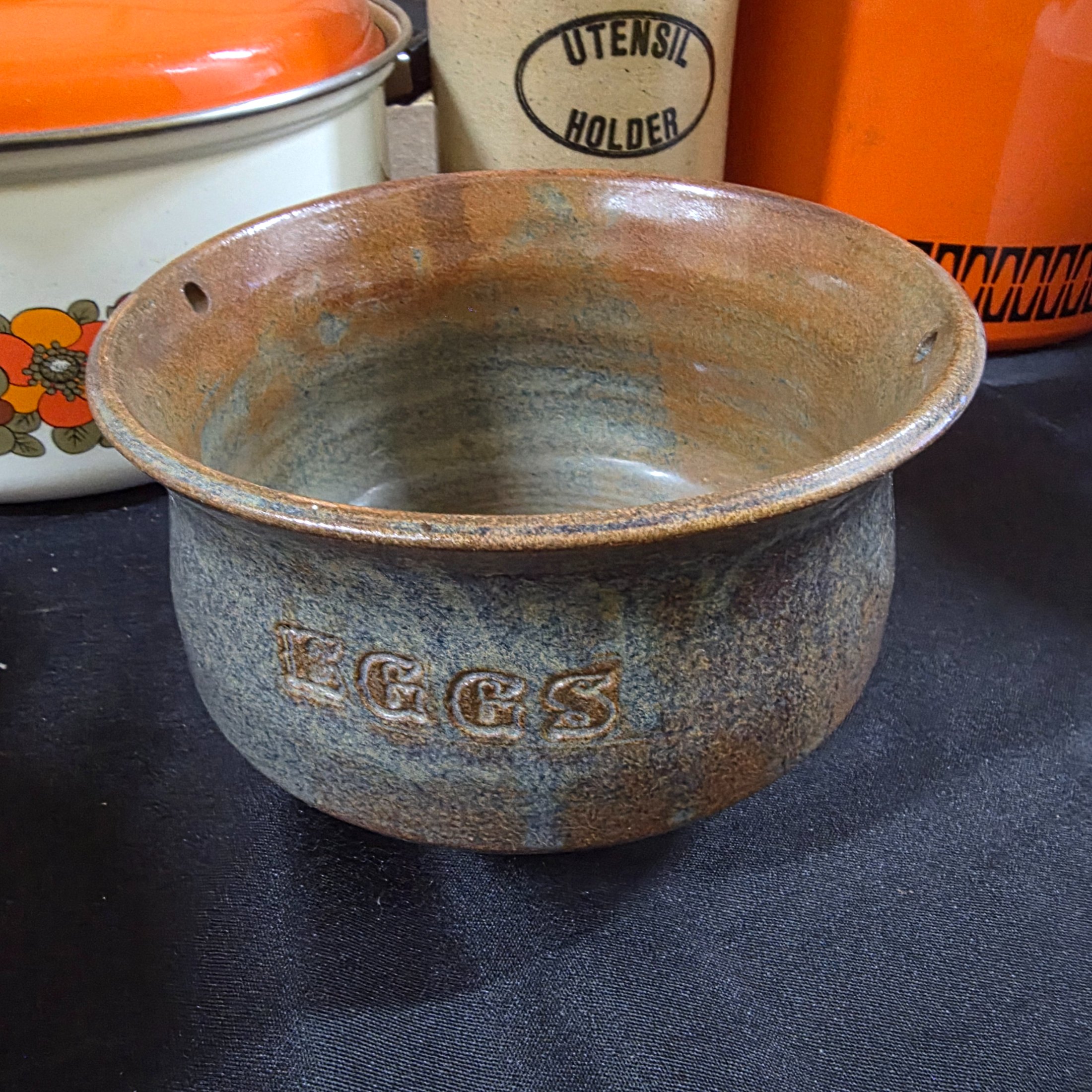 A varied collection of vintage kitchenware and homewares, showcasing mid-century design and practical items, including enamel pots, ceramic and stoneware pieces, and Australian beer coolers. - View 6