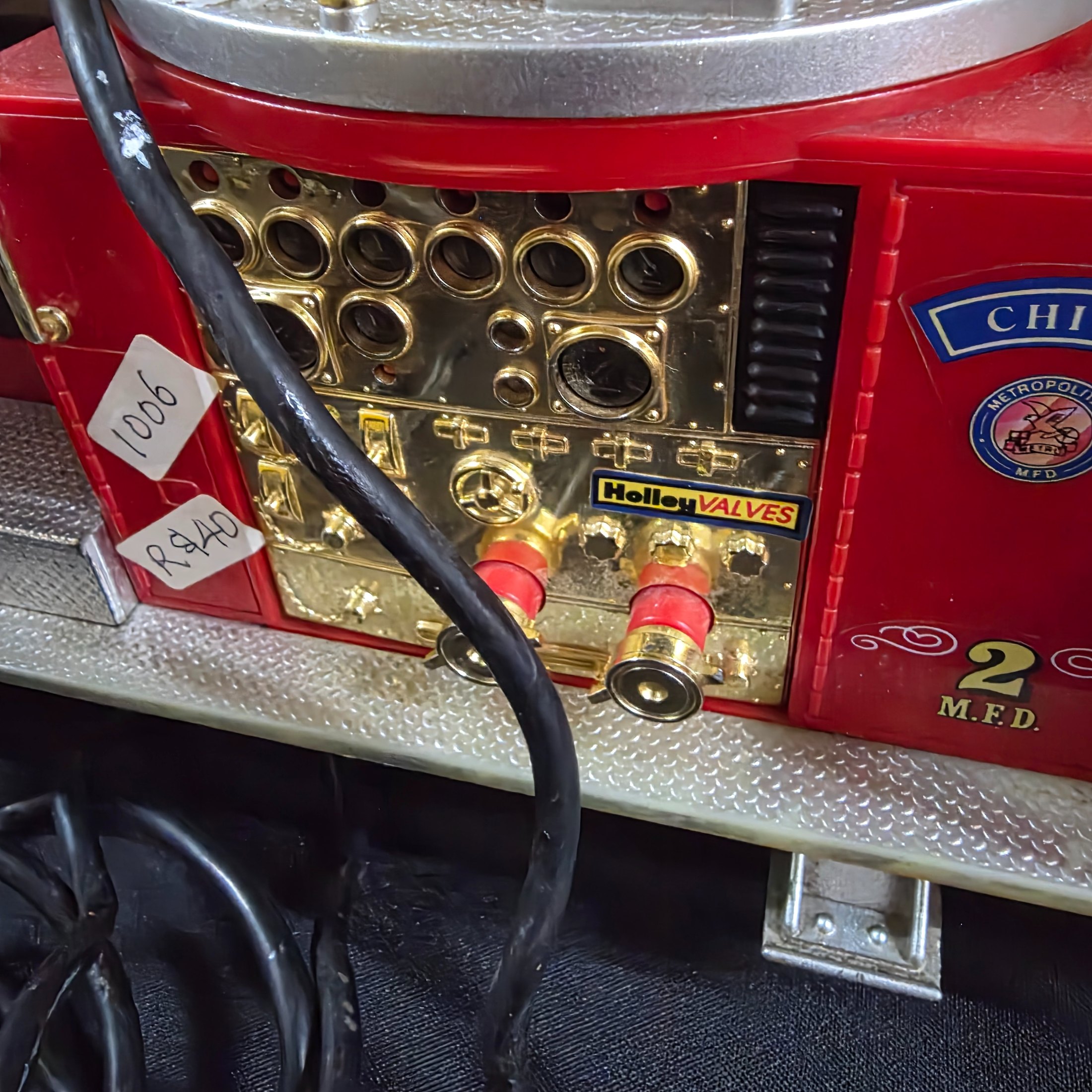 A vintage New Bright remote control toy fire engine, dating from around 1990, constructed from plastic and metal components. - View 6