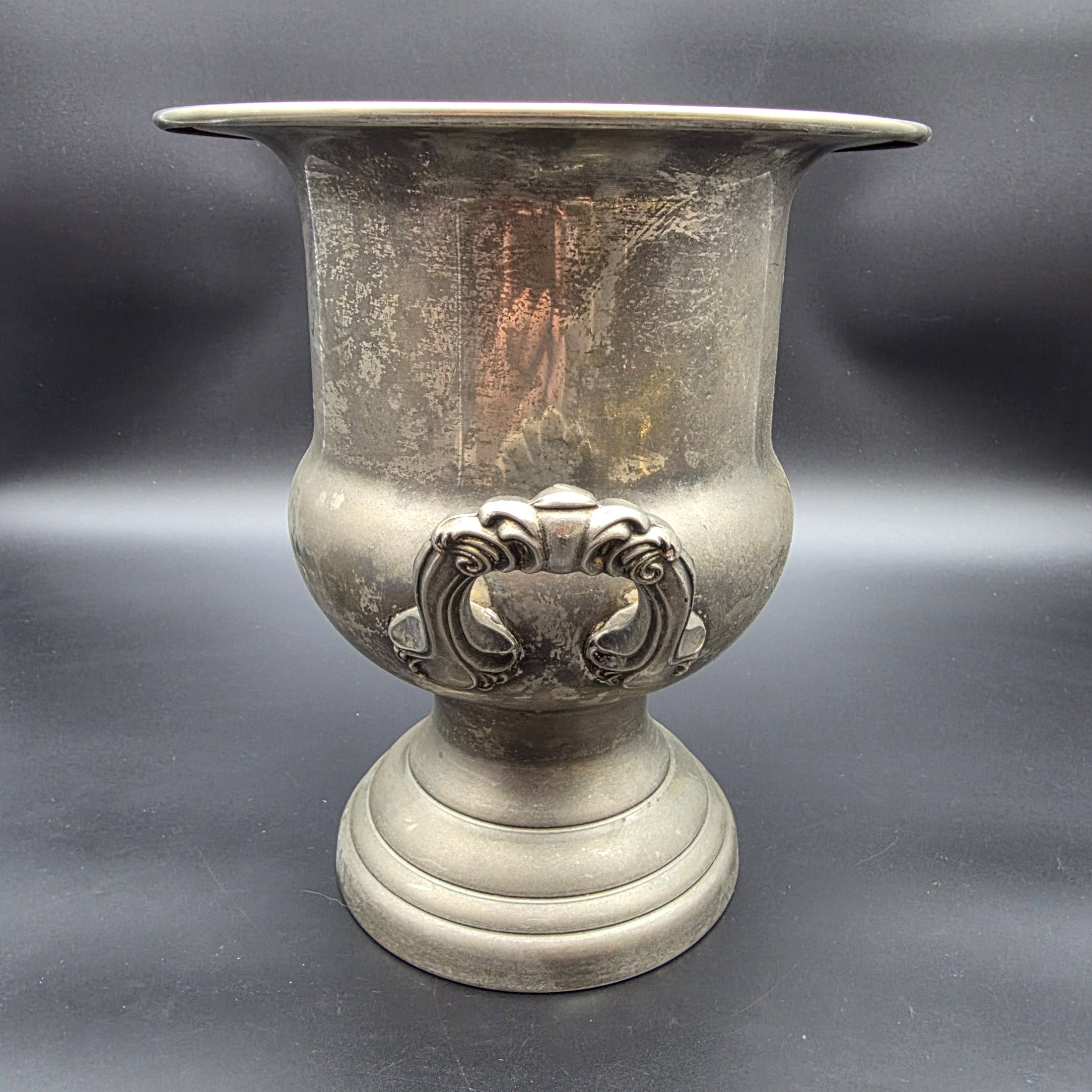 A vintage pewter commemorative urn from the late 20th or early 21st century, featuring a classic pedestal design, two ornate twisted handles, and a flared rim. - View 4