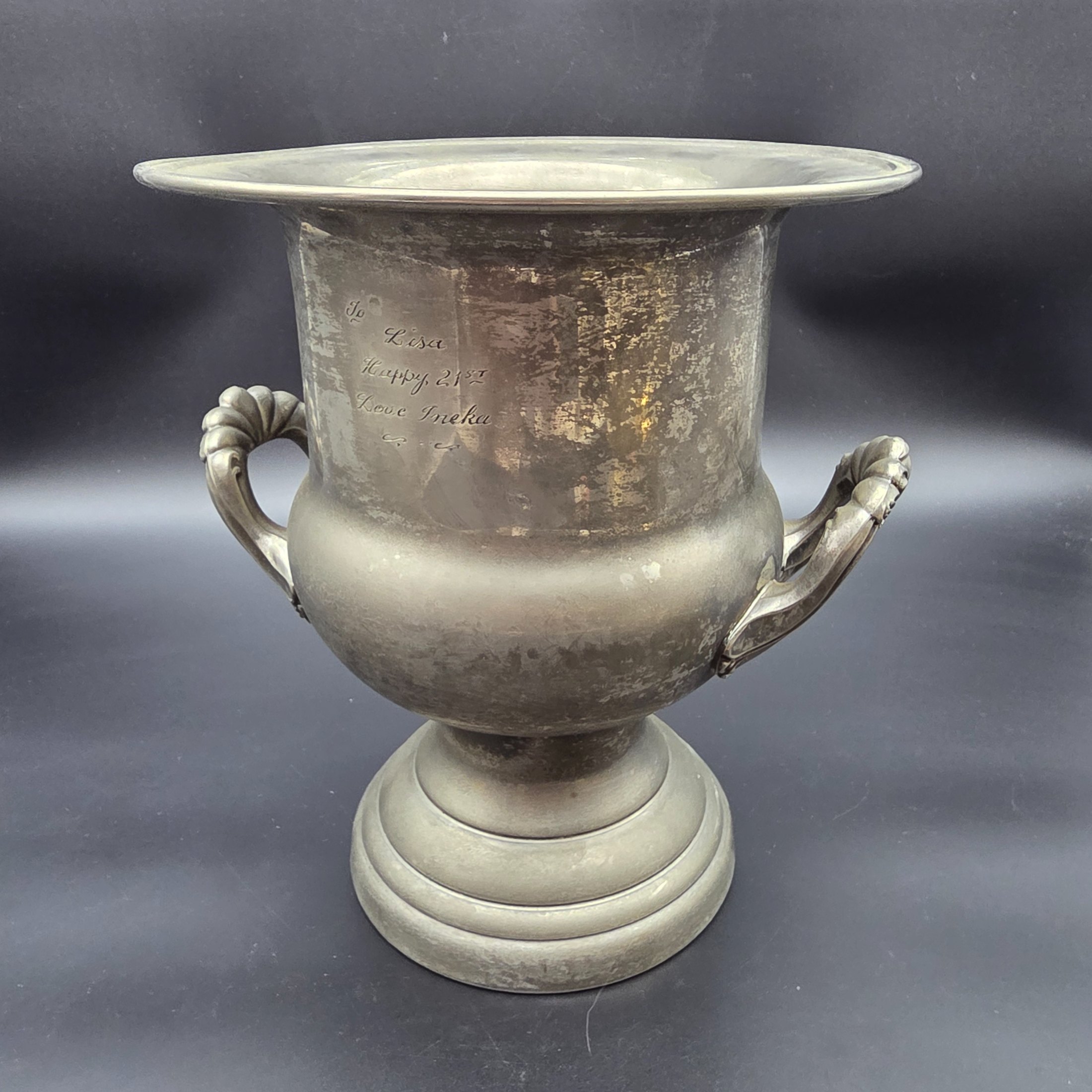 A vintage pewter commemorative urn from the late 20th or early 21st century, featuring a classic pedestal design, two ornate twisted handles, and a flared rim. - View 5