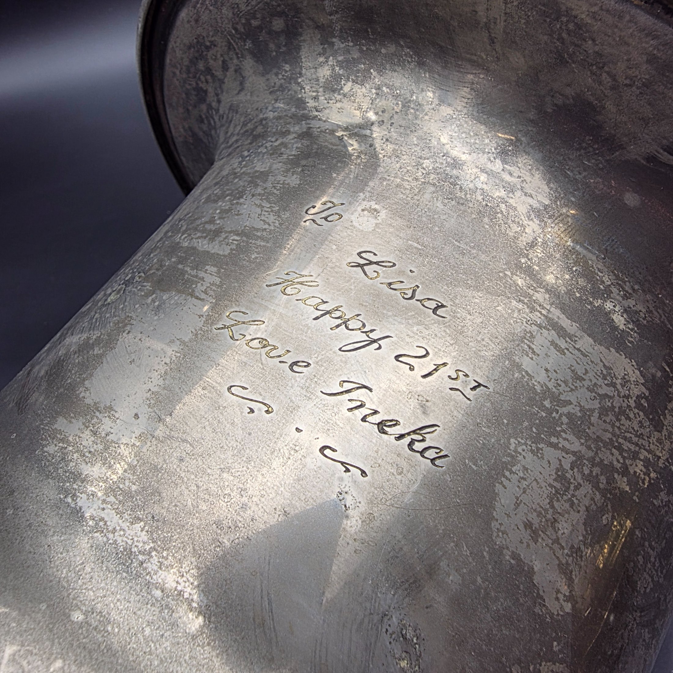 A vintage pewter commemorative urn from the late 20th or early 21st century, featuring a classic pedestal design, two ornate twisted handles, and a flared rim. - View 6
