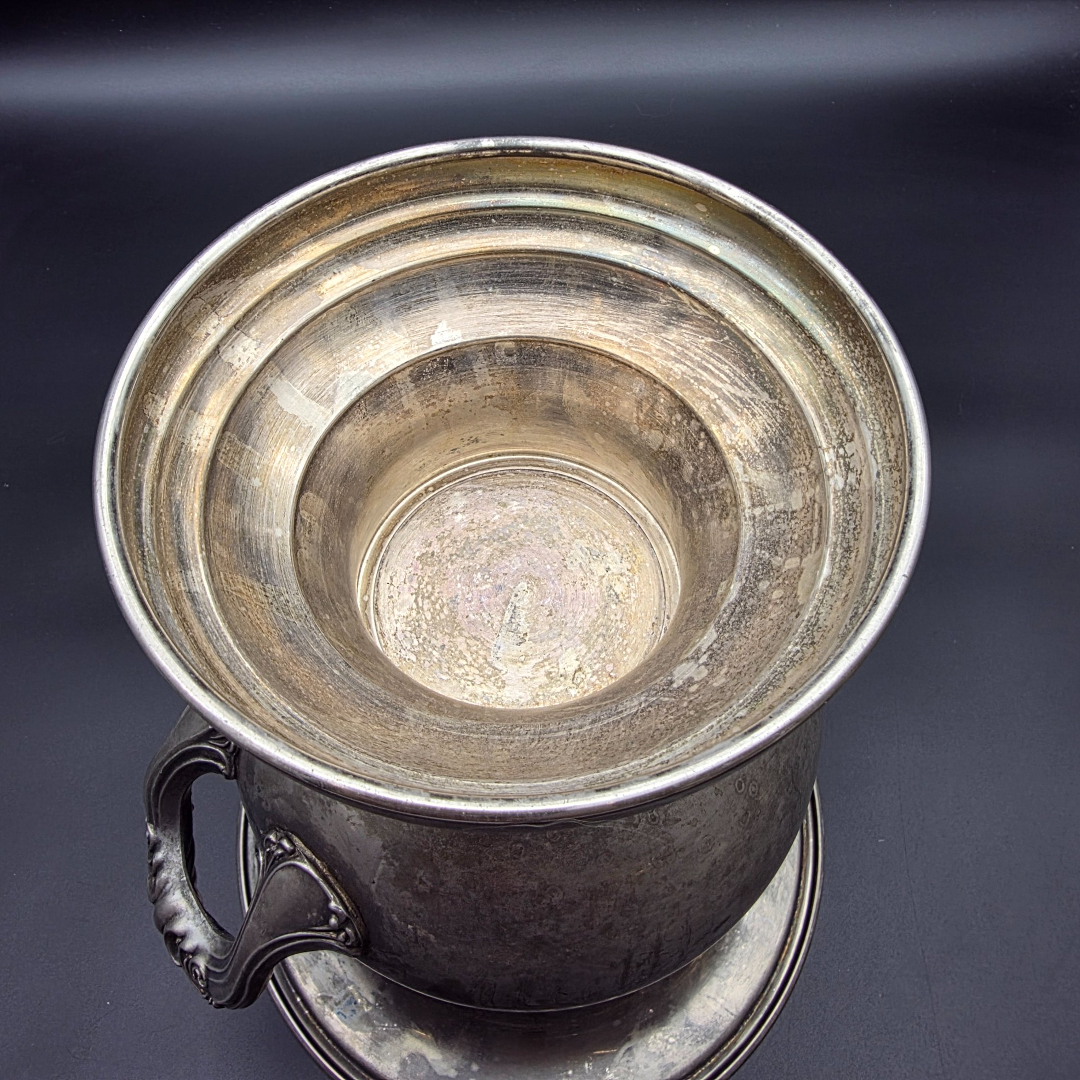 A vintage pewter commemorative urn from the late 20th or early 21st century, featuring a classic pedestal design, two ornate twisted handles, and a flared rim. - View 8