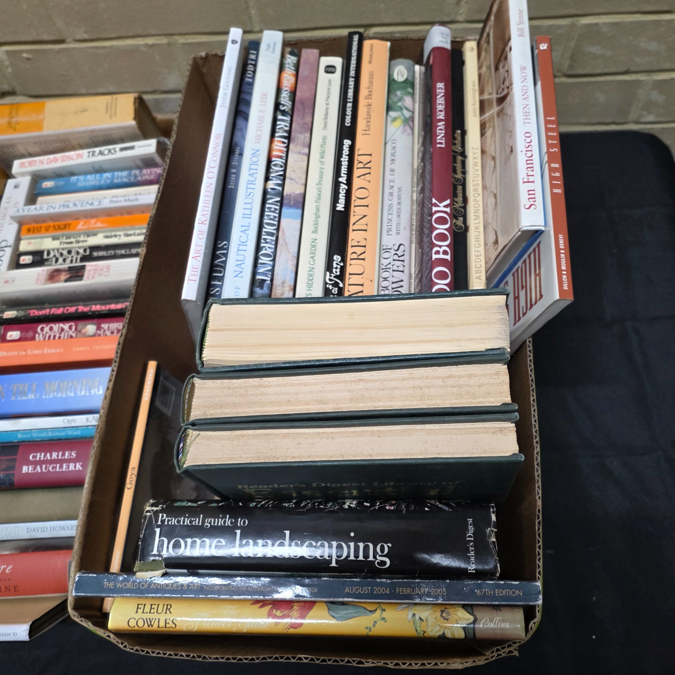 A diverse collection of pre-owned books spanning various genres, including fiction, non-fiction, nature, craft, and history, presented in several cardboard boxes. - View 5
