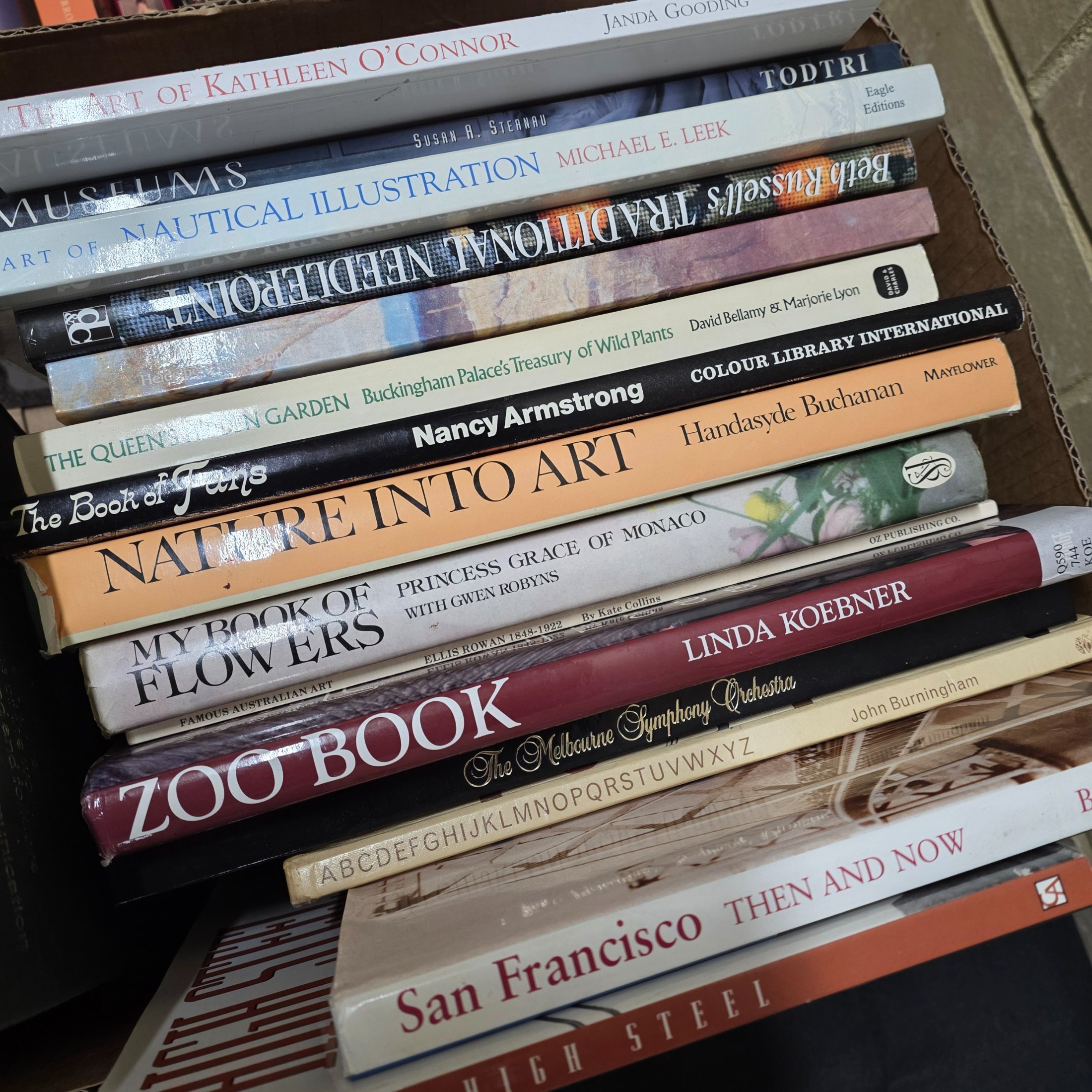 A diverse collection of pre-owned books spanning various genres, including fiction, non-fiction, nature, craft, and history, presented in several cardboard boxes. - View 6