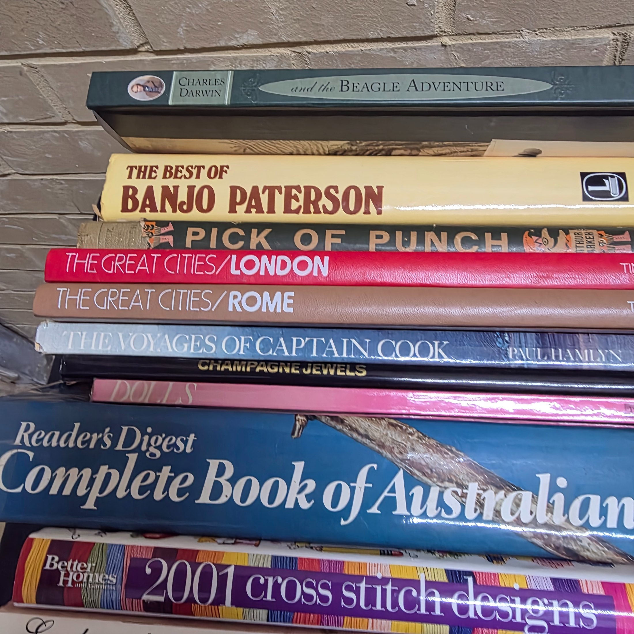 A diverse collection of pre-owned books spanning various genres, including fiction, non-fiction, nature, craft, and history, presented in several cardboard boxes. - View 7