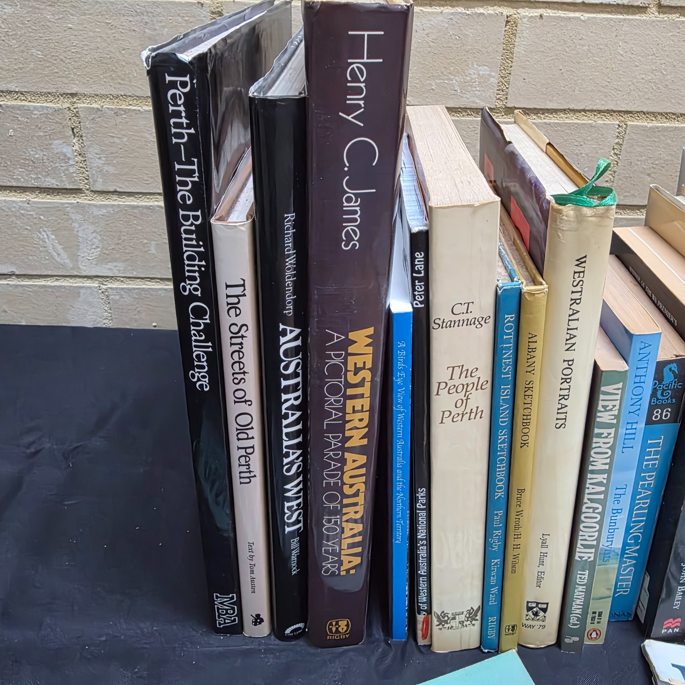 A substantial collection of books and magazines detailing the history, culture, and natural beauty of Western Australia, including specific regional studies and general overviews. - View 2