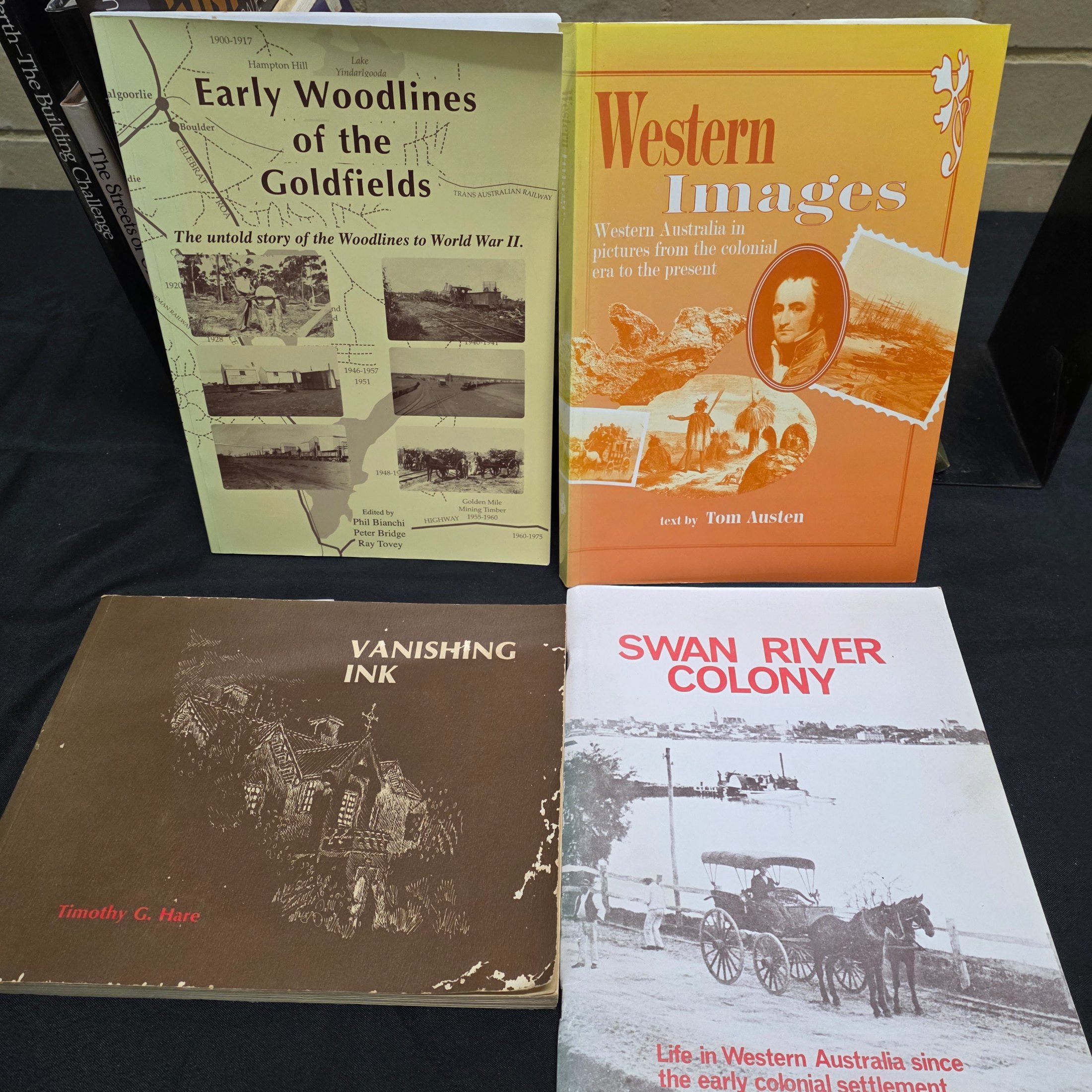 A substantial collection of books and magazines detailing the history, culture, and natural beauty of Western Australia, including specific regional studies and general overviews. - View 5