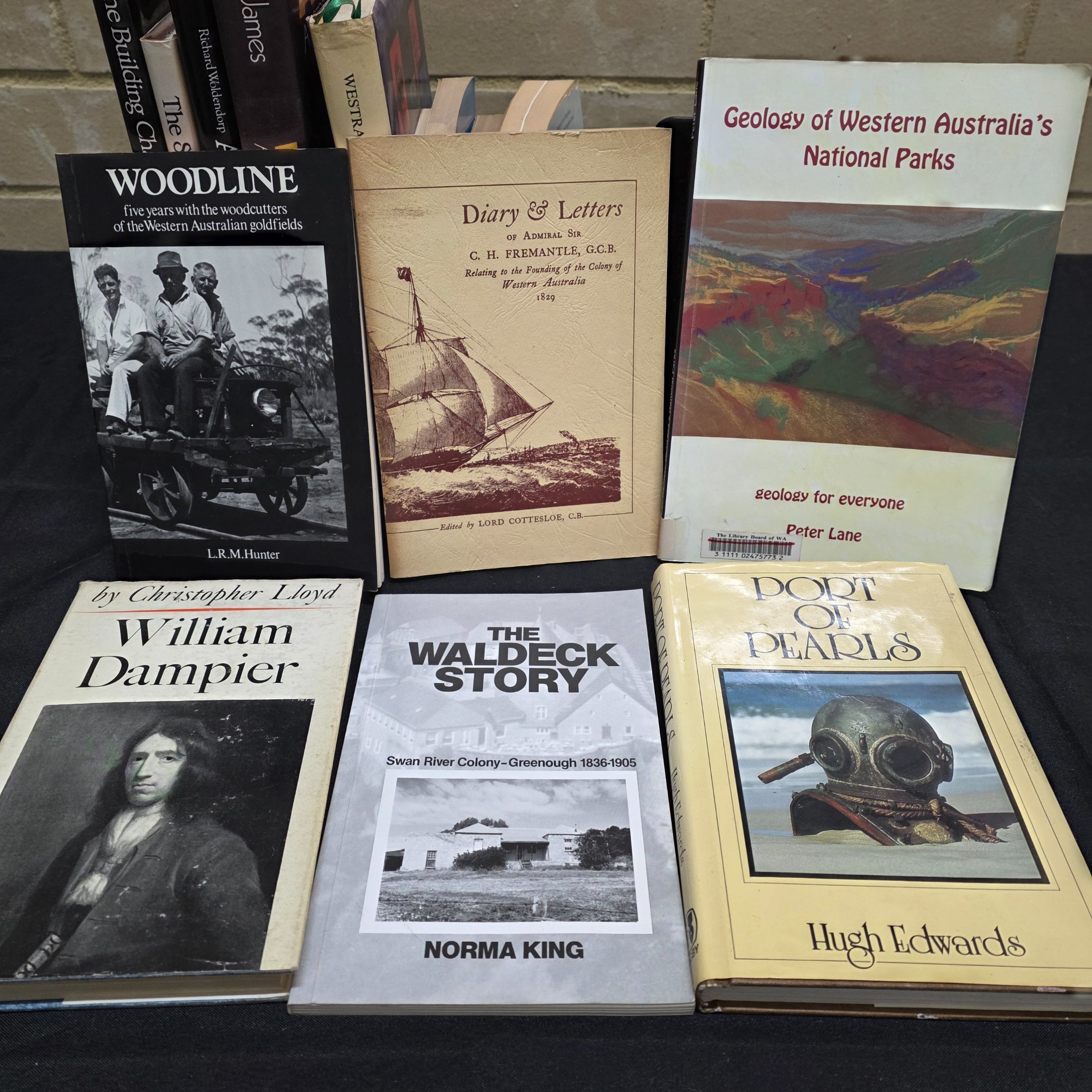 A substantial collection of books and magazines detailing the history, culture, and natural beauty of Western Australia, including specific regional studies and general overviews. - View 7