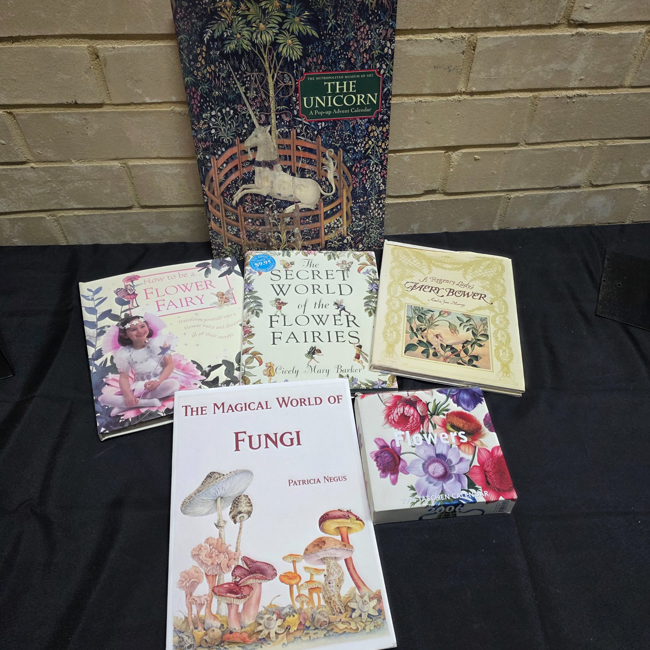 Lot of 6 Nature, Fairy, and Fantasy-Themed Books and Calendar — Lot 168, photograph 1