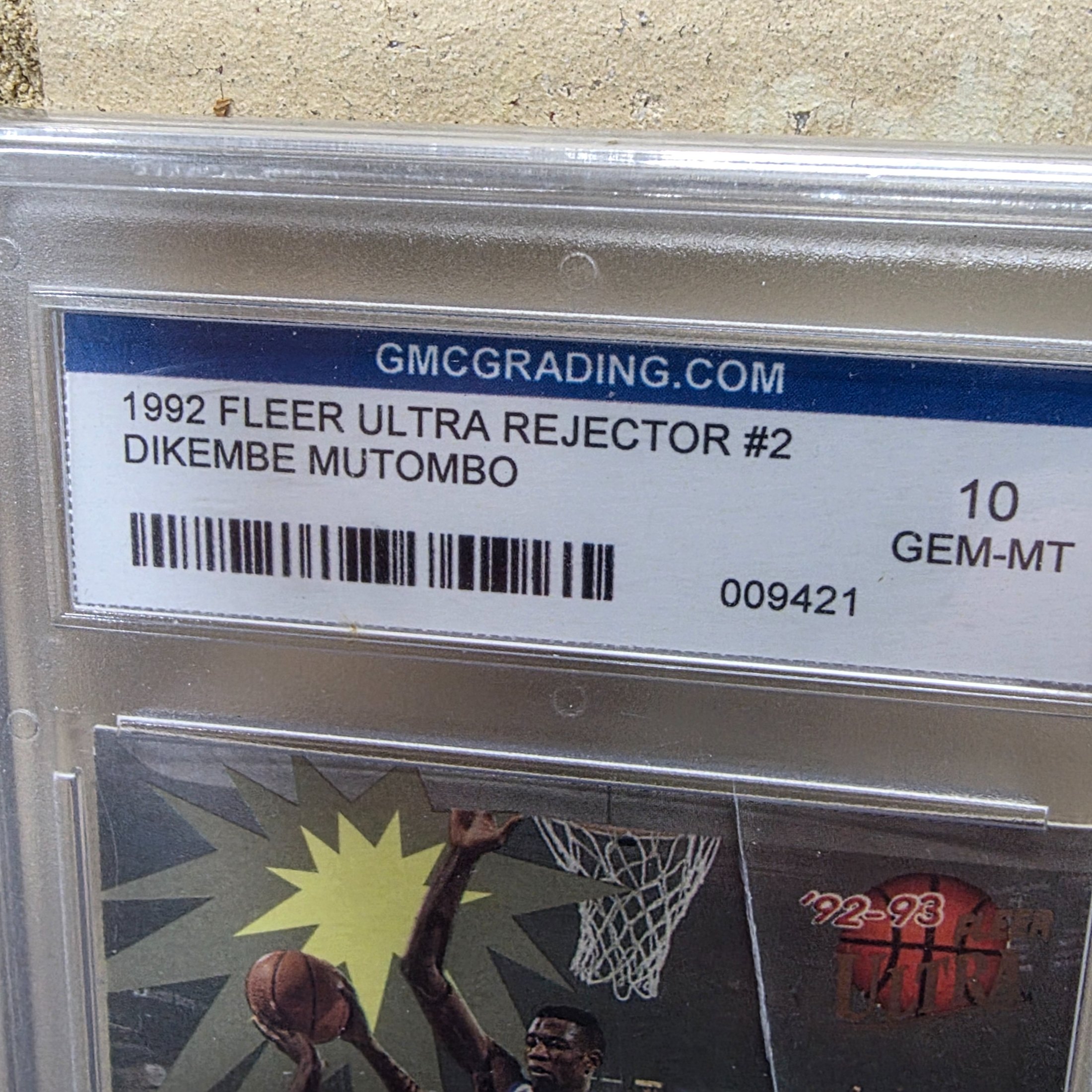 A professionally graded 1992 Fleer Ultra Rejector #2 basketball trading card featuring Dikembe Mutombo, achieving a GEM-MT 10 grade from GMC Grading. - View 3