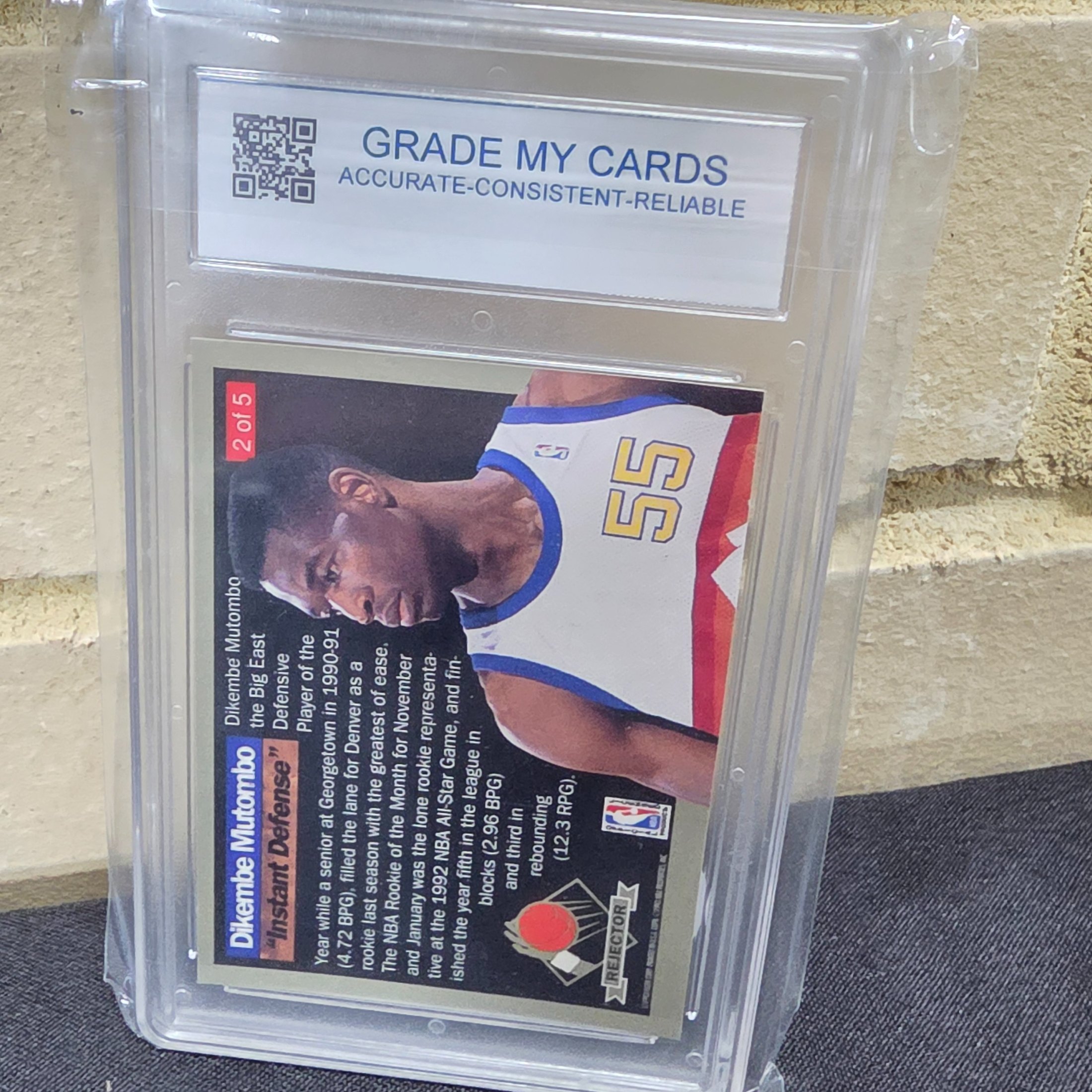 A professionally graded 1992 Fleer Ultra Rejector #2 basketball trading card featuring Dikembe Mutombo, achieving a GEM-MT 10 grade from GMC Grading. - View 4
