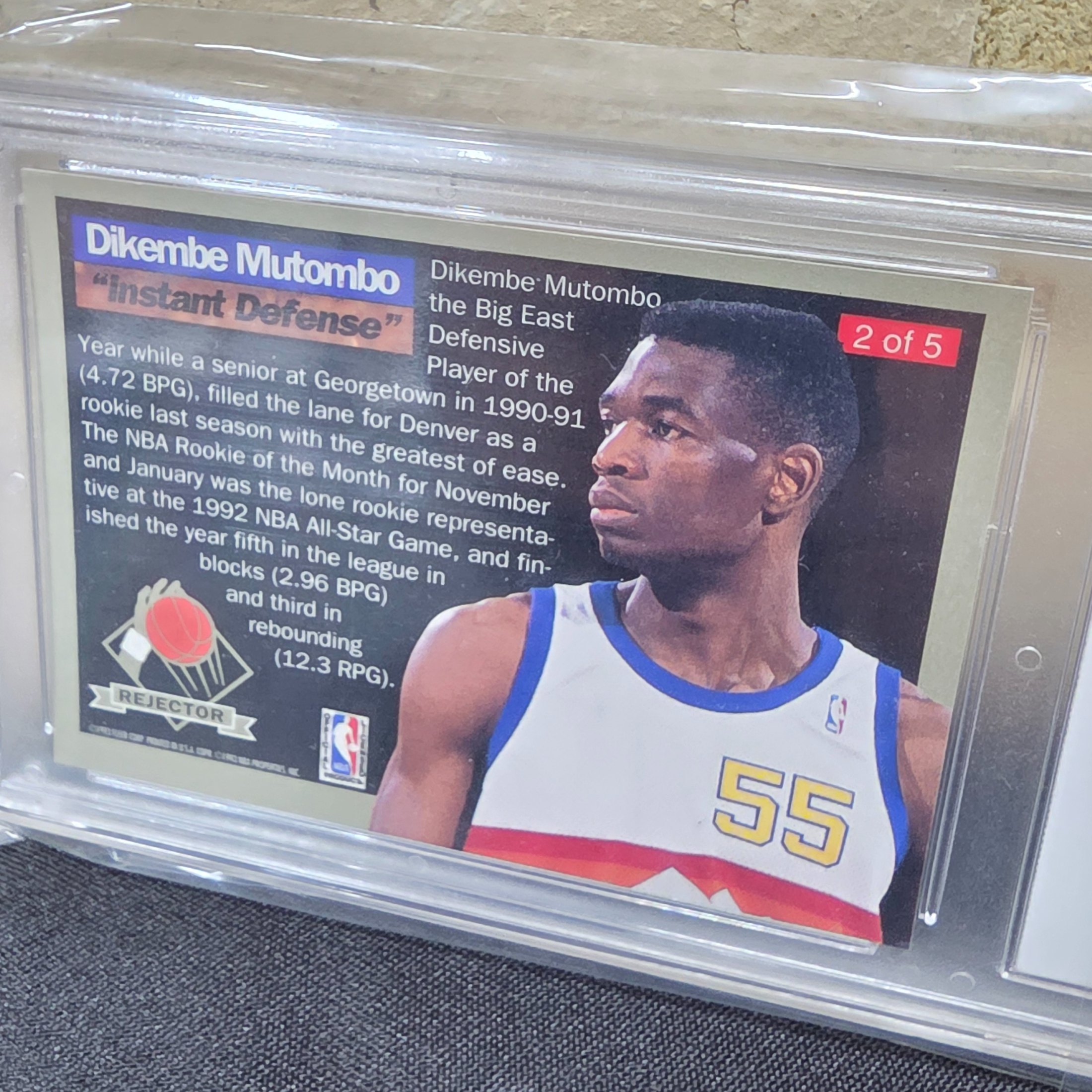A professionally graded 1992 Fleer Ultra Rejector #2 basketball trading card featuring Dikembe Mutombo, achieving a GEM-MT 10 grade from GMC Grading. - View 5