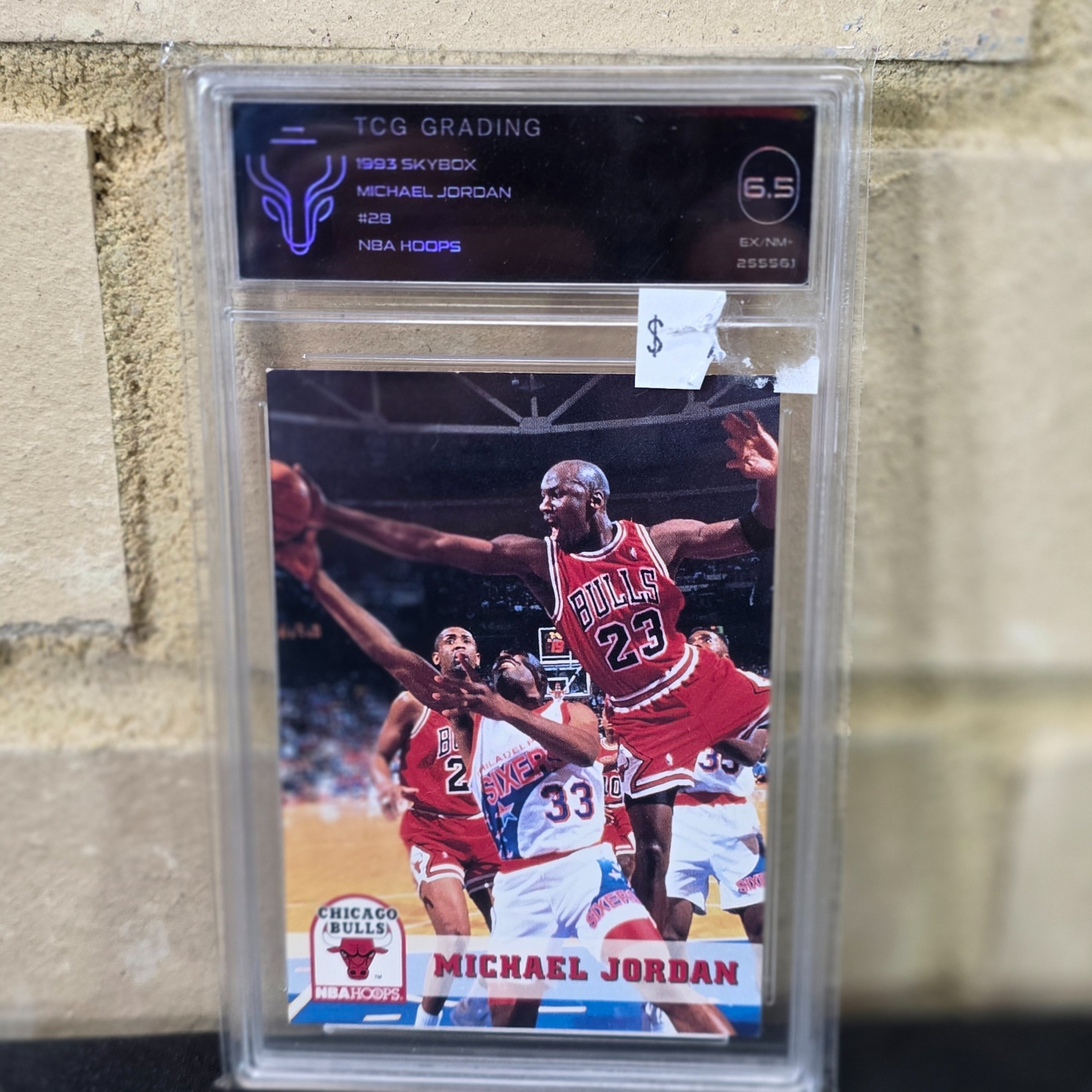 A 1993 Skybox NBA Hoops Michael Jordan #28 basketball trading card, professionally graded 6.5 (EX-NM+) by TCG Grading, featuring the iconic Chicago Bulls player.