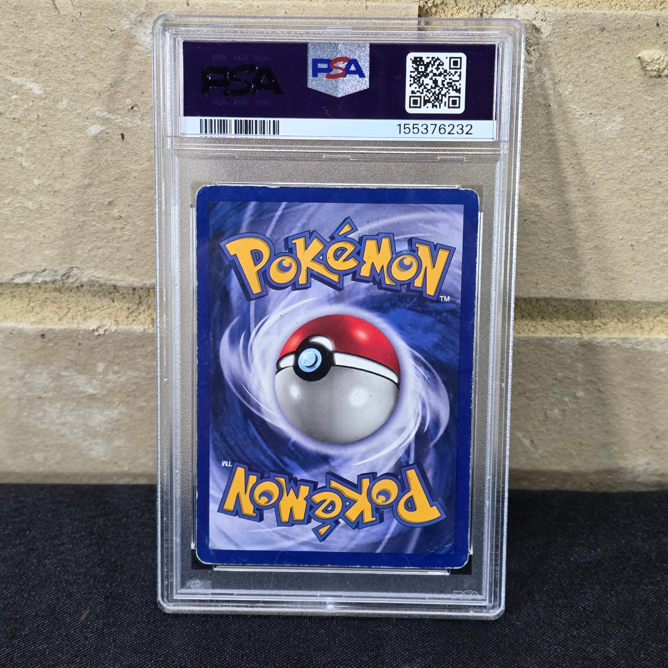 A 1999 Pokémon Game Machamp-Holo 1st Edition trading card, professionally graded PSA GOOD 2, displayed in a protective slab. - View 2