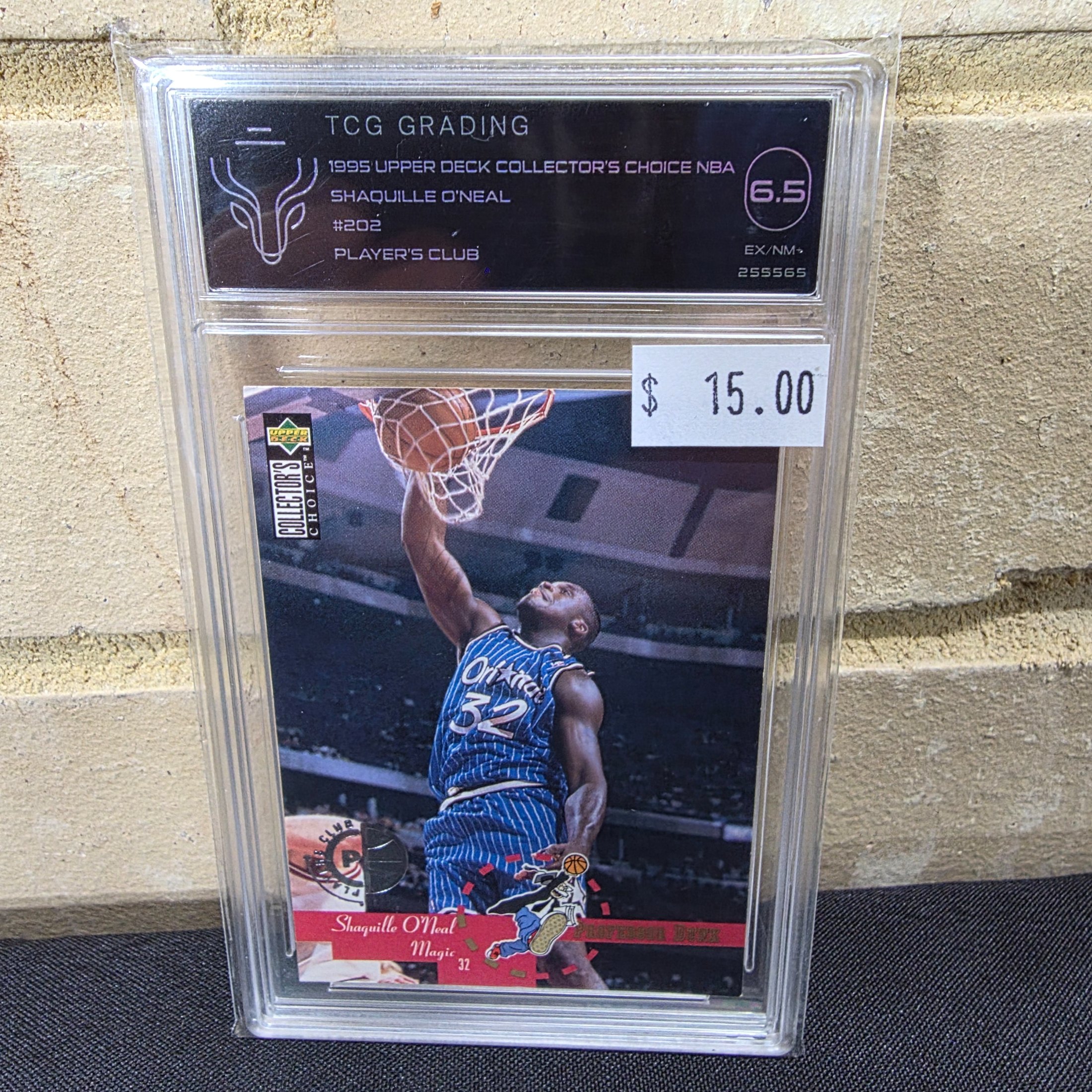 A 1995 Upper Deck Collector's Choice NBA Shaquille O'Neal #202 Player's Club basketball card, professionally graded 6.5 EX/NM+ by TCG Grading, encased in a protective slab.