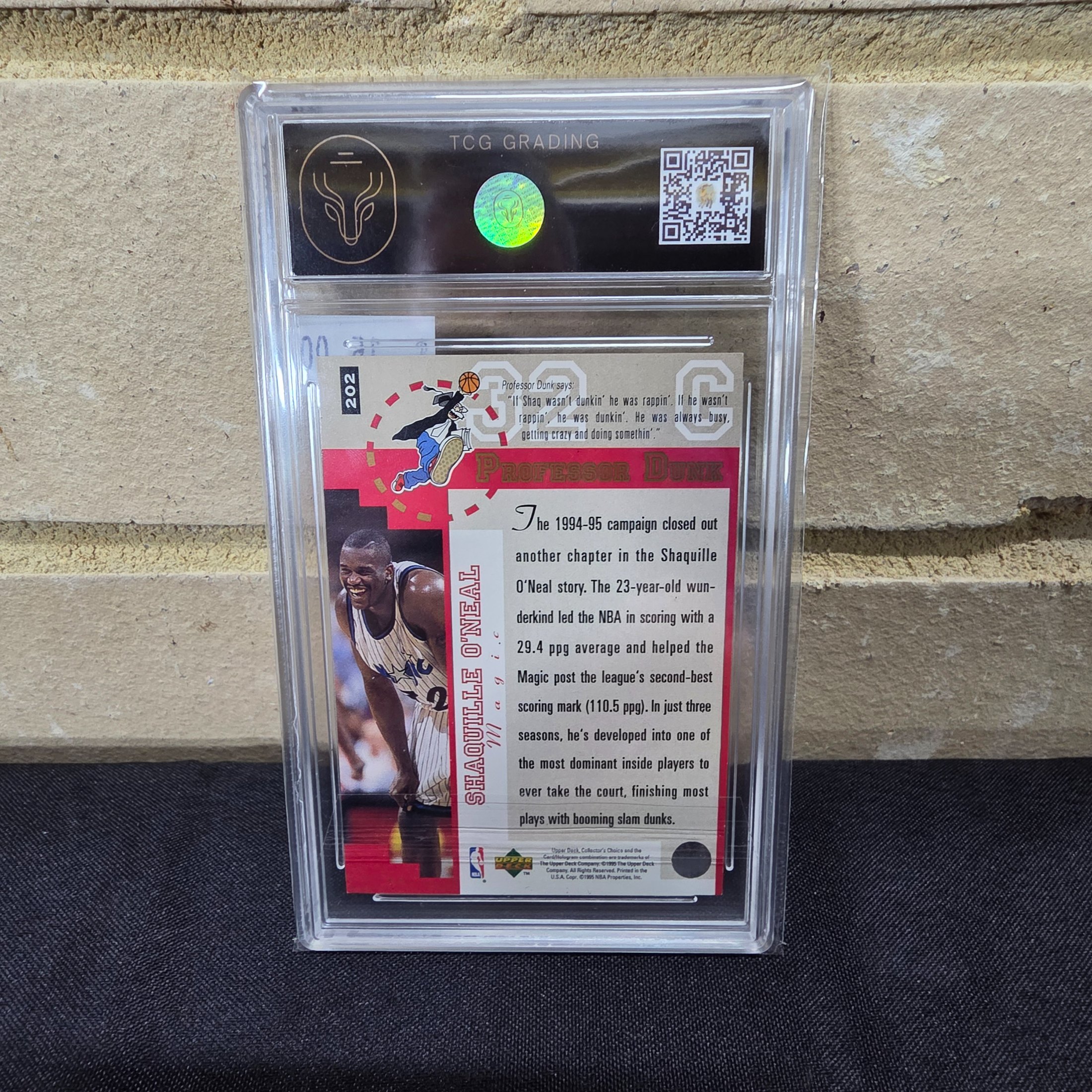 A 1995 Upper Deck Collector's Choice NBA Shaquille O'Neal #202 Player's Club basketball card, professionally graded 6.5 EX/NM+ by TCG Grading, encased in a protective slab. - View 5
