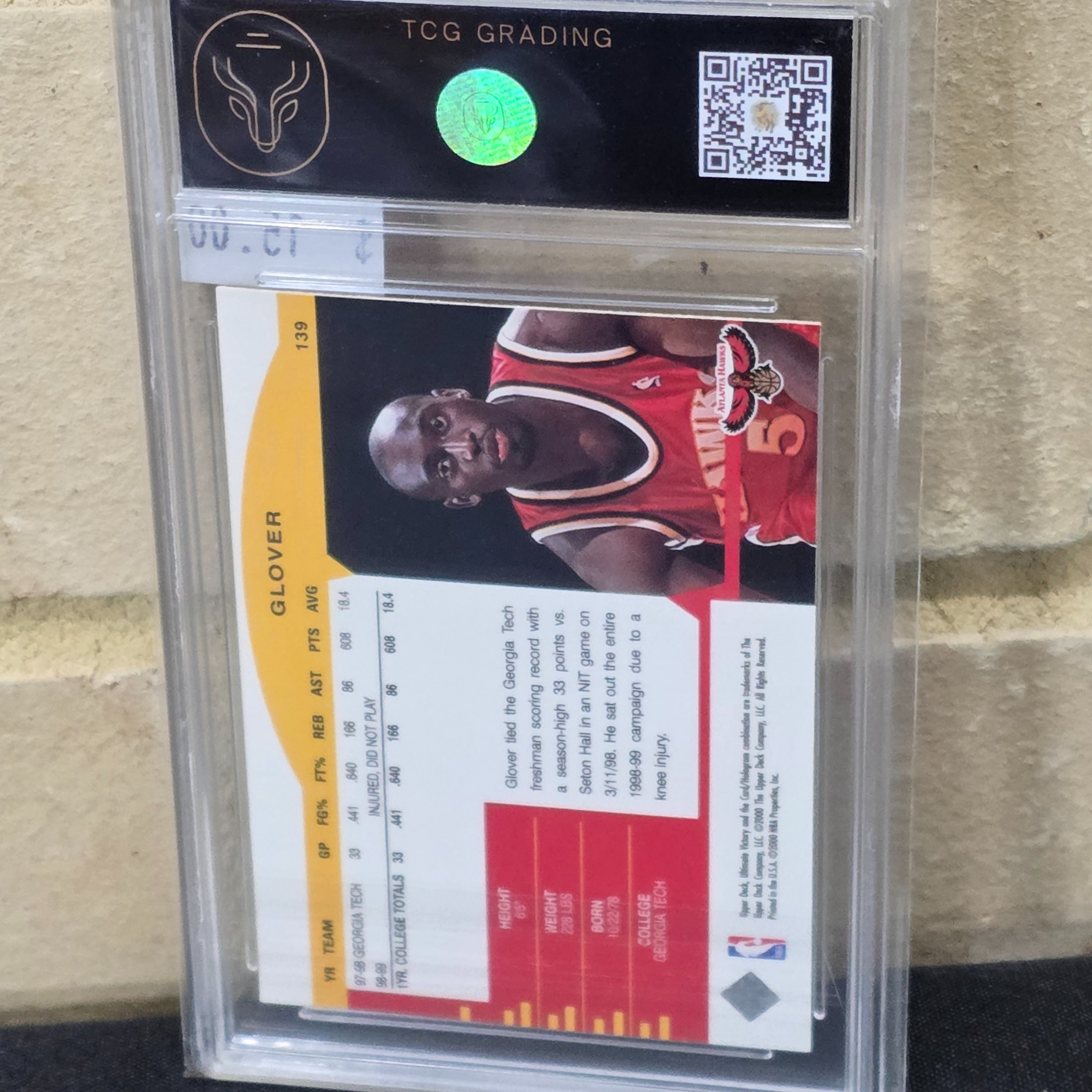 A 1999 Upper Deck NBA basketball rookie card of Dion Glover, graded 7 NM by TCG Grading, encapsulated in a protective slab. - View 3