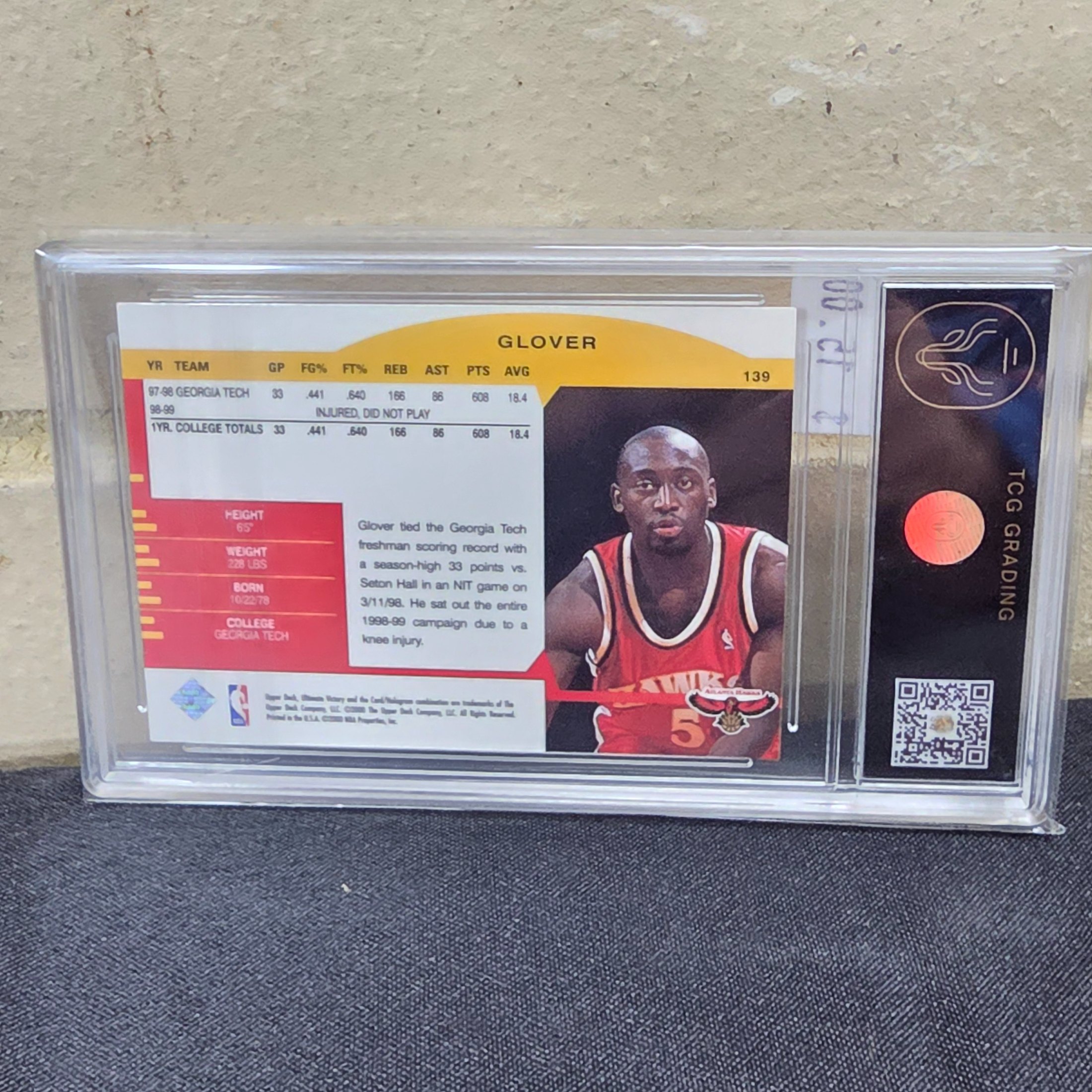 A 1999 Upper Deck NBA basketball rookie card of Dion Glover, graded 7 NM by TCG Grading, encapsulated in a protective slab. - View 6