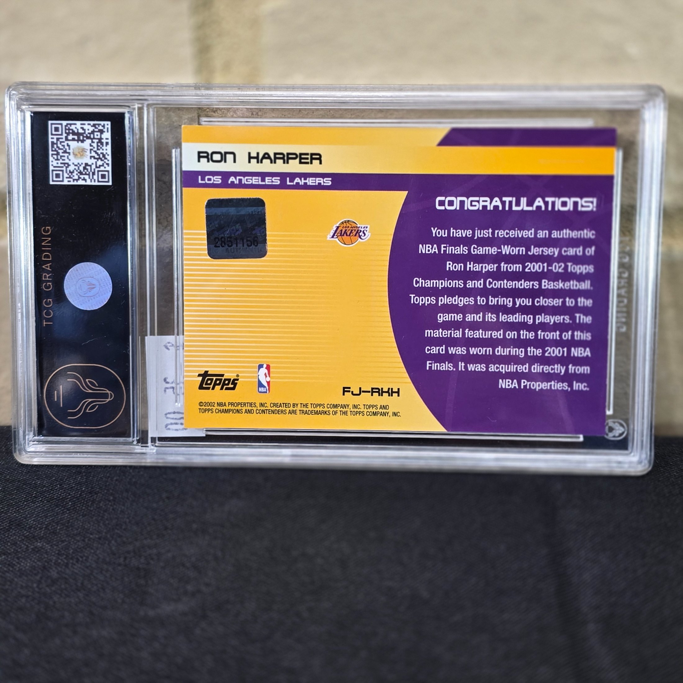 A 2001 Topps NBA Finals Journey graded trading card featuring Ron Harper with an authentic game-worn jersey swatch, encapsulated in a TCG Grading slab. - View 4