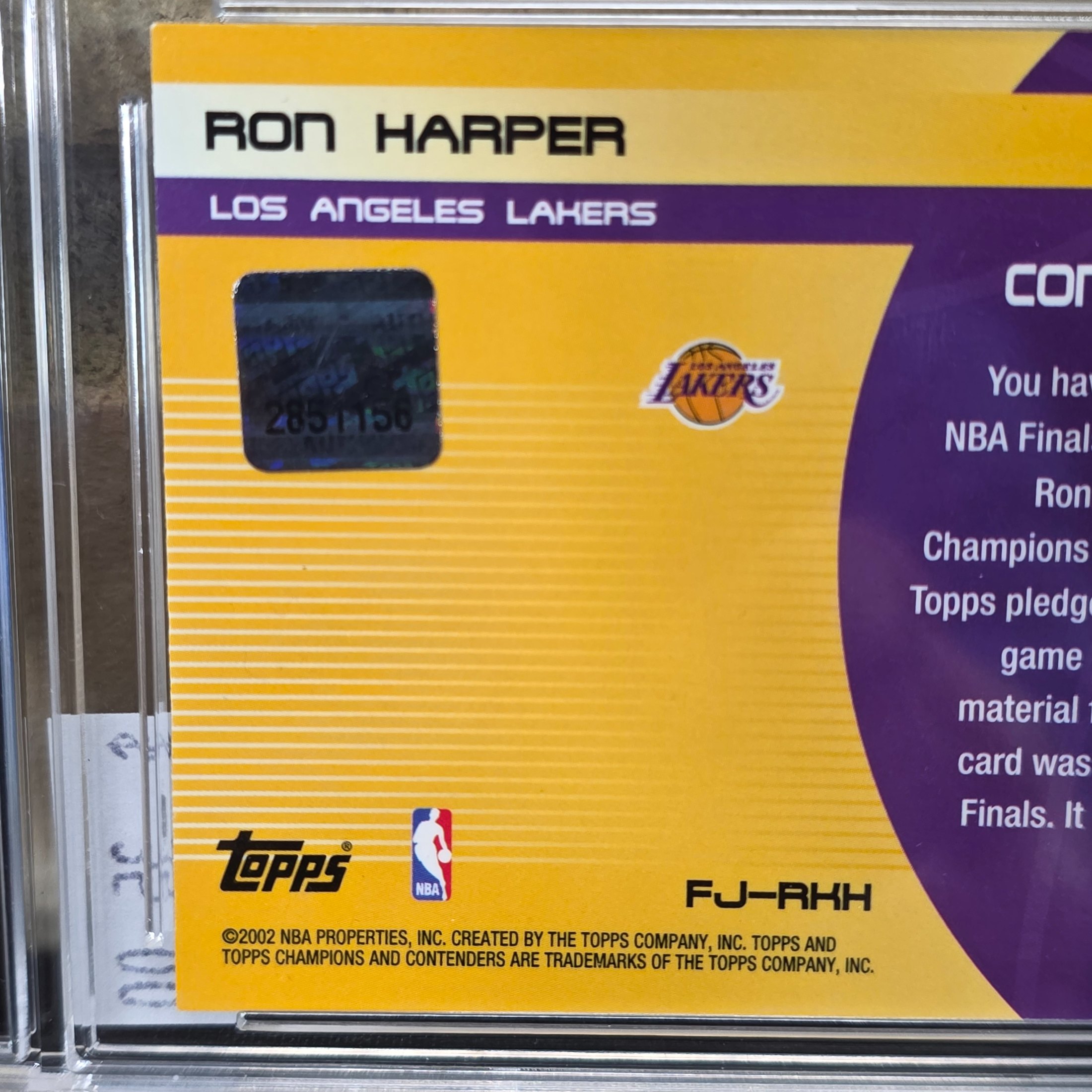 A 2001 Topps NBA Finals Journey graded trading card featuring Ron Harper with an authentic game-worn jersey swatch, encapsulated in a TCG Grading slab. - View 5