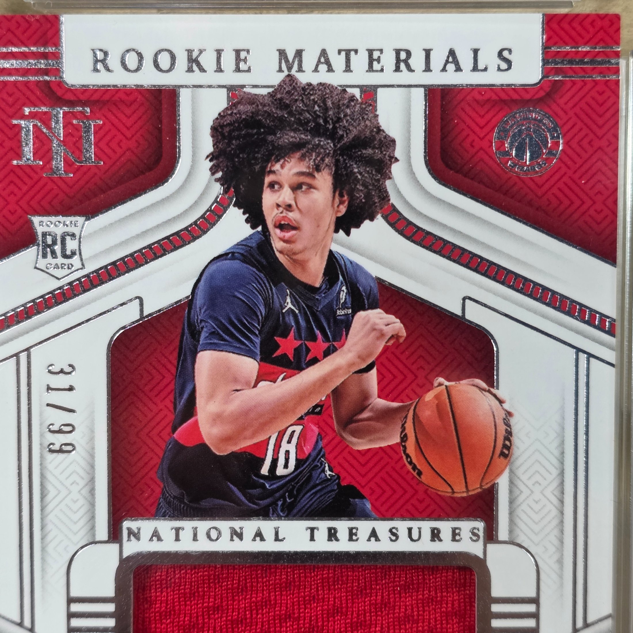 A 2025 Panini National Treasures NBA Kyshawn George Rookie Materials trading card, graded 8 NM/MT by TCG Grading, featuring a jersey patch. - View 2