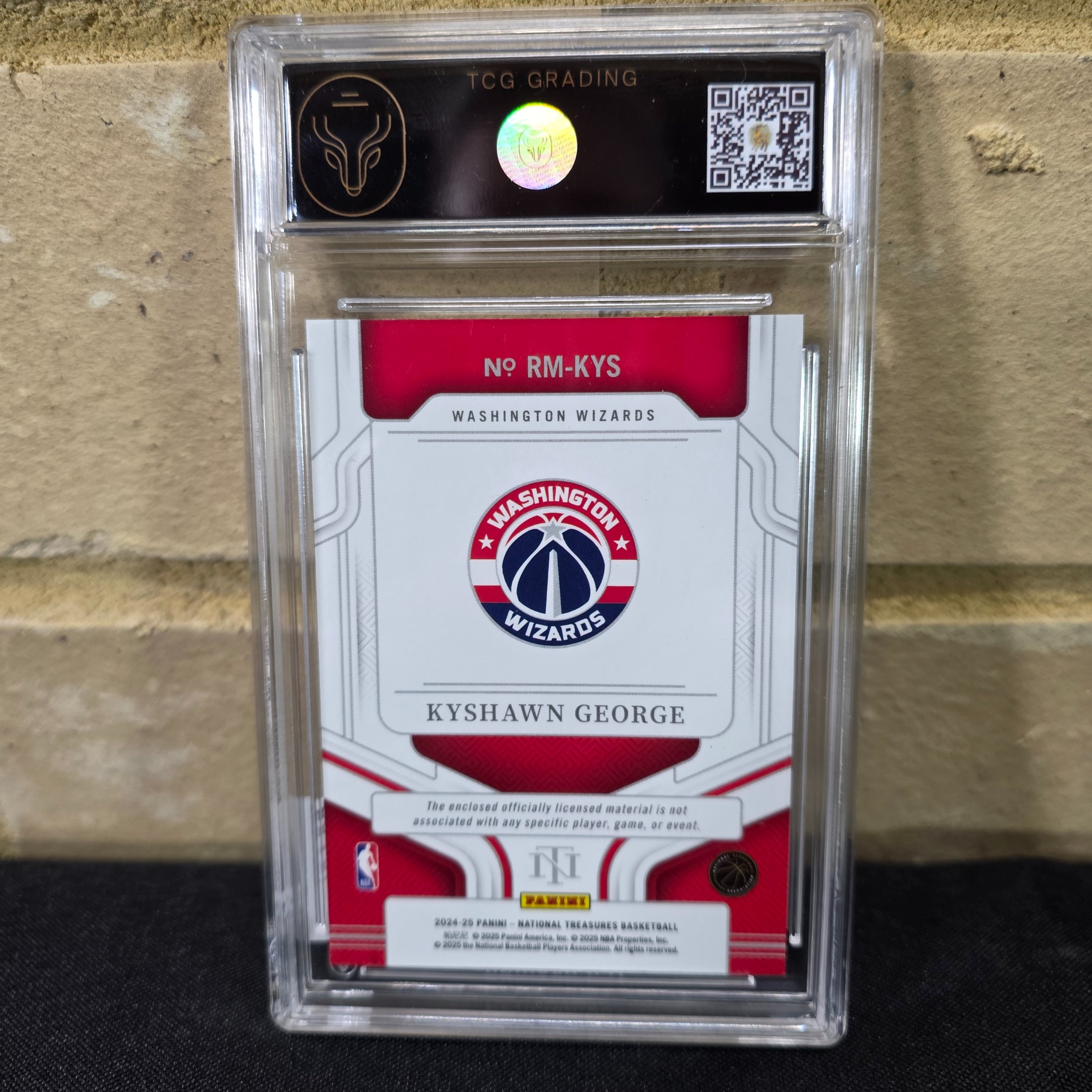 A 2025 Panini National Treasures NBA Kyshawn George Rookie Materials trading card, graded 8 NM/MT by TCG Grading, featuring a jersey patch. - View 5